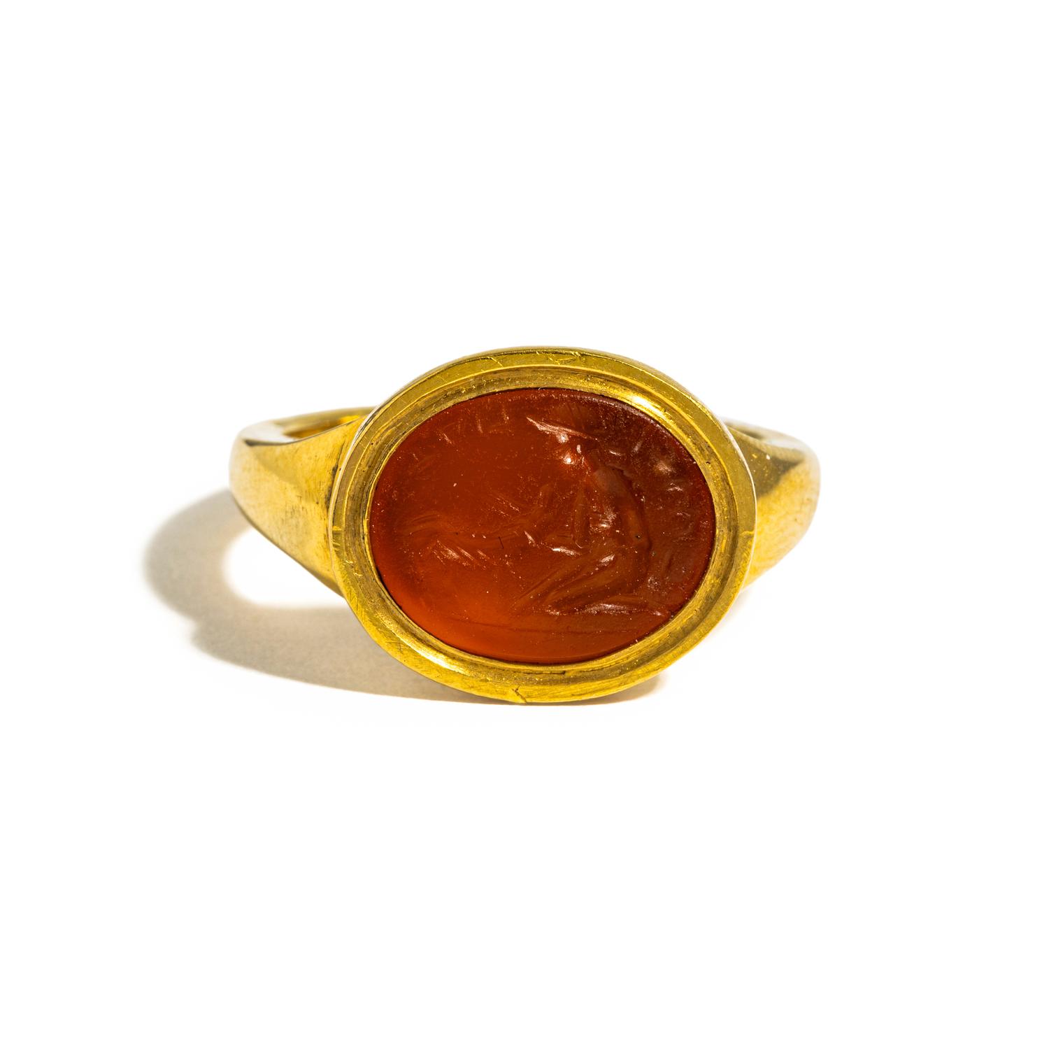 A Roman Carnelian Ring Stone with the God Mercury and a Sheep — Set in a gold ring