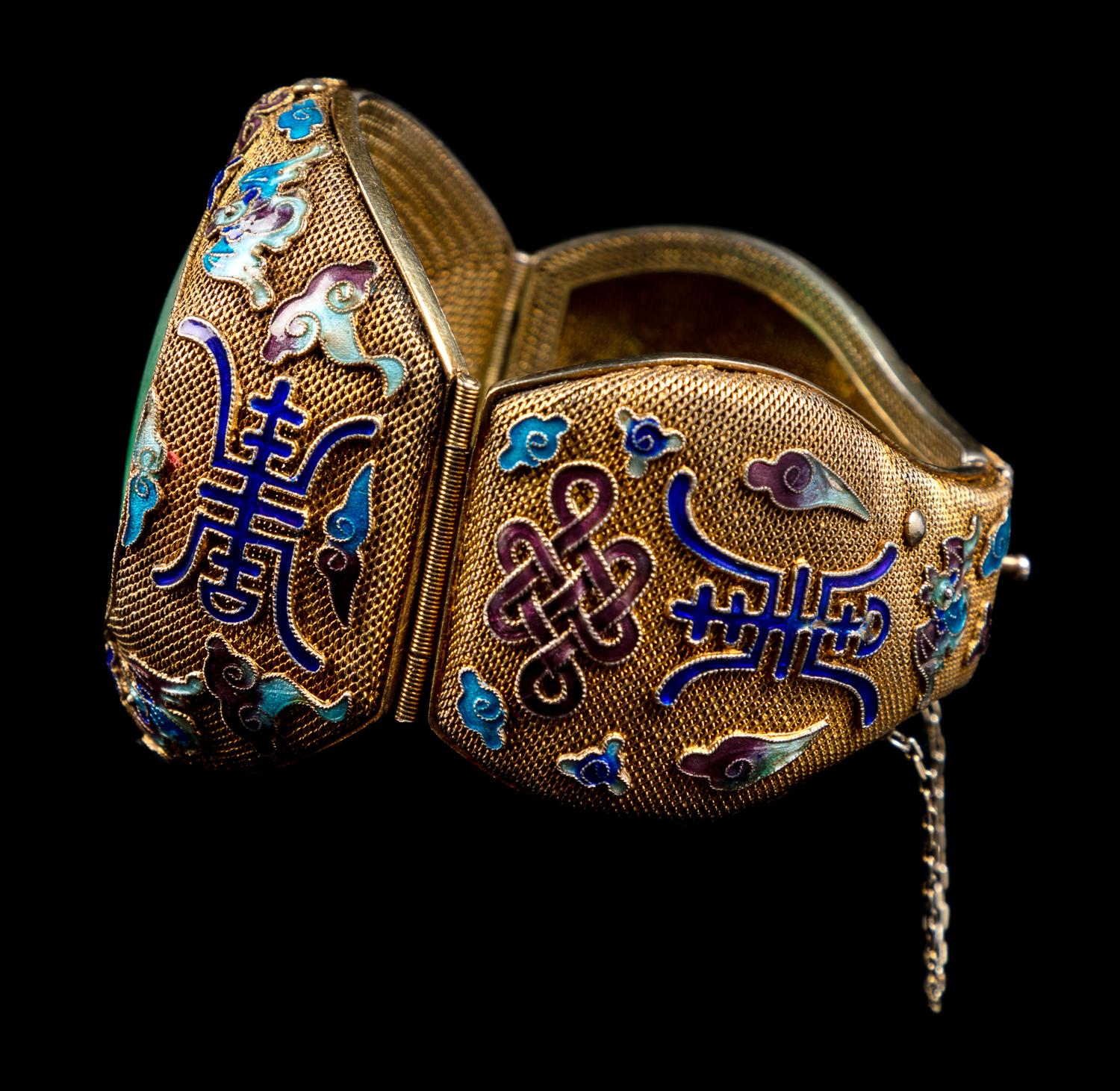 An Apple Green and Pale Celadon Jadeite Inset and Enamel Inlaid Silver-Gilt Filigree Bracelet