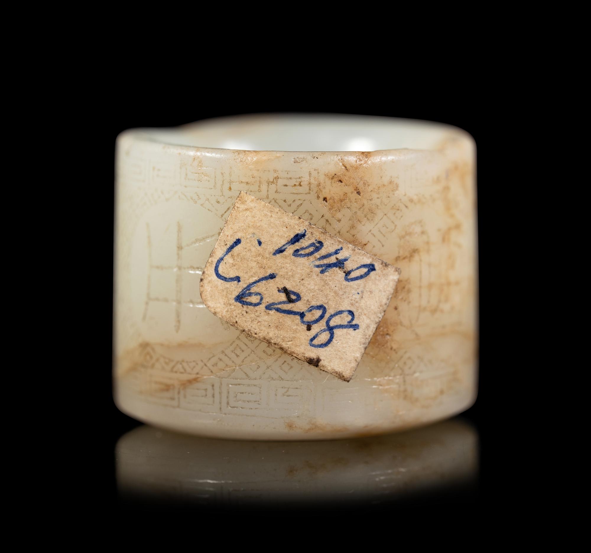 An Incised White Jade Archer's Ring