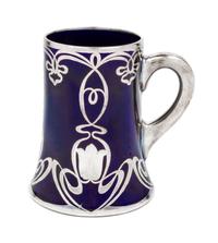A Lenox Art Nouveau Silver Overlay Porcelain Mug Height 5 3/8 inches.