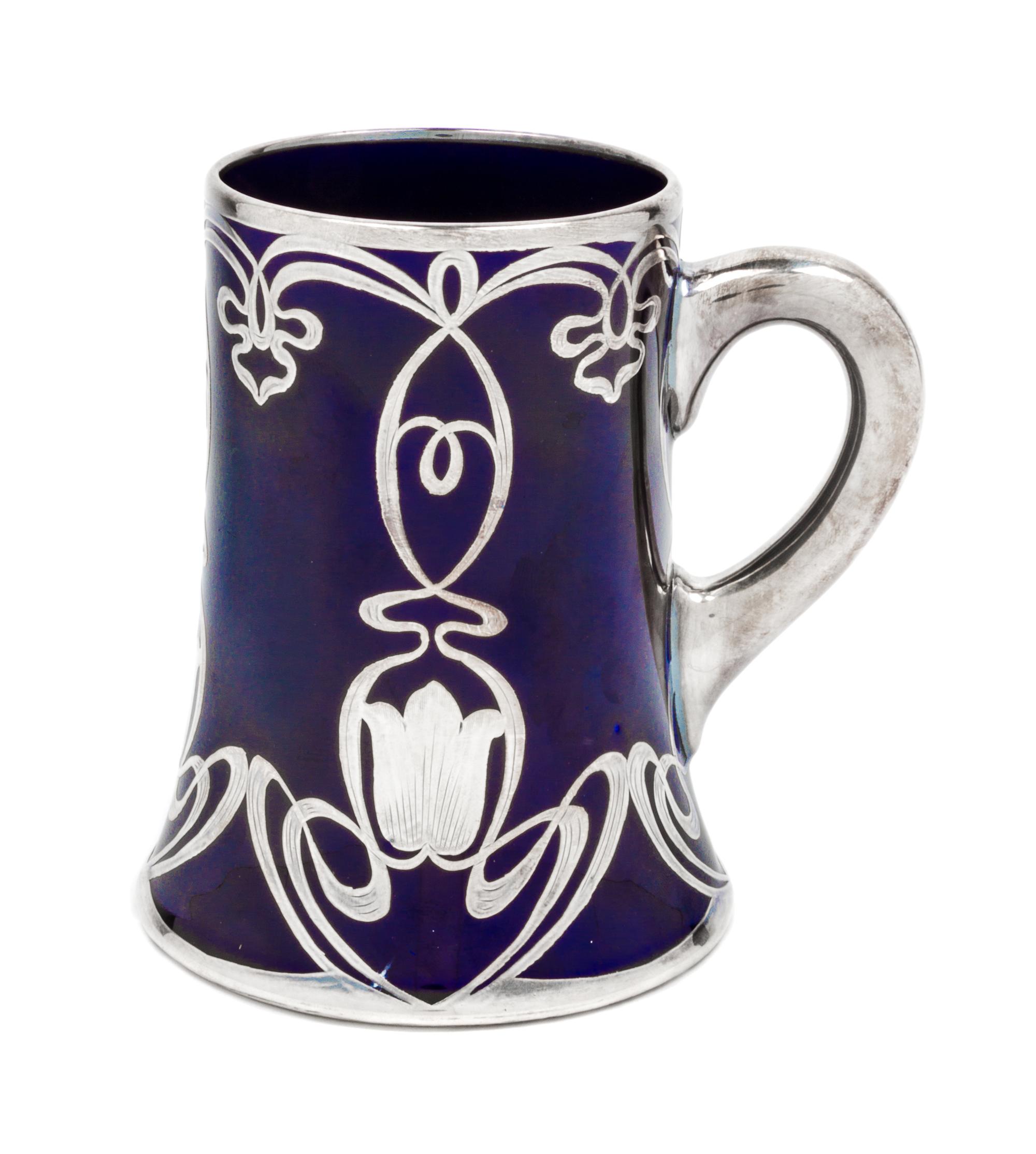 A Lenox Art Nouveau Silver Overlay Porcelain Mug Height 5 3/8 inches.