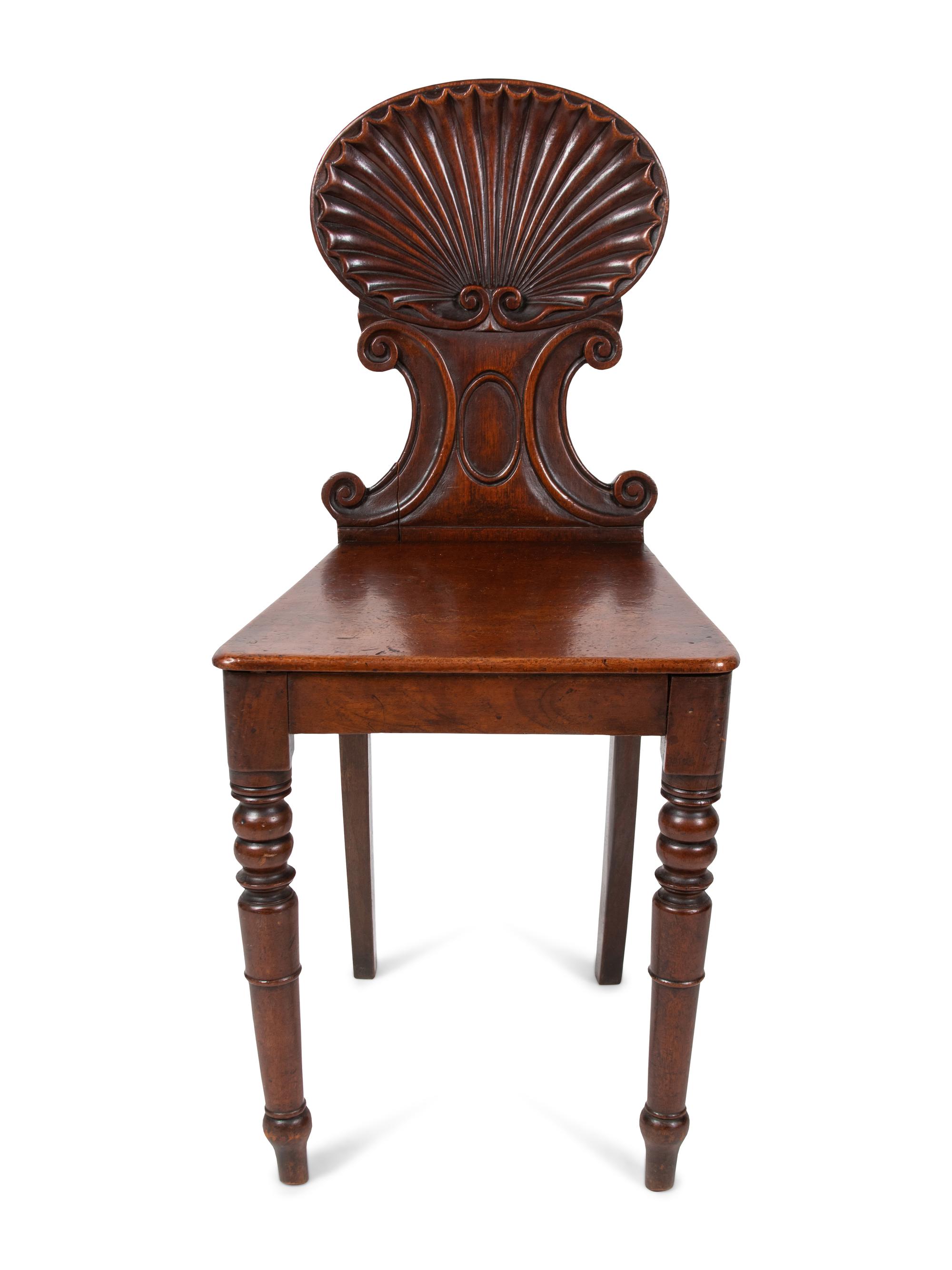 A Pair of Regency Style Mahogany Hall Chairs