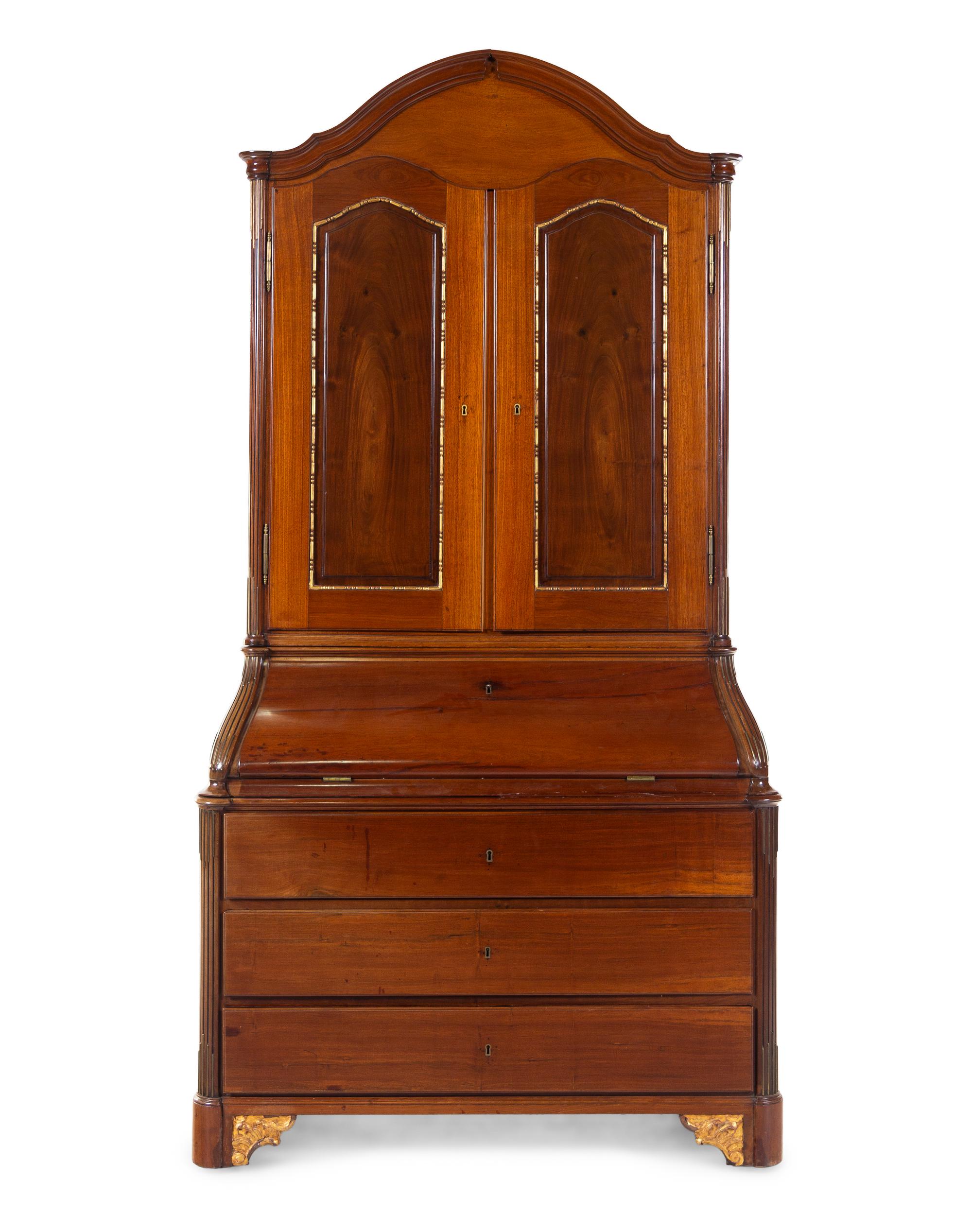 A Baltic Neoclassical Parcel Gilt Walnut Secretary
