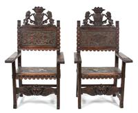 A Pair of Renaissance Revival Carved Oak Armchairs Height 53 inches. — 19TH CENTURY
