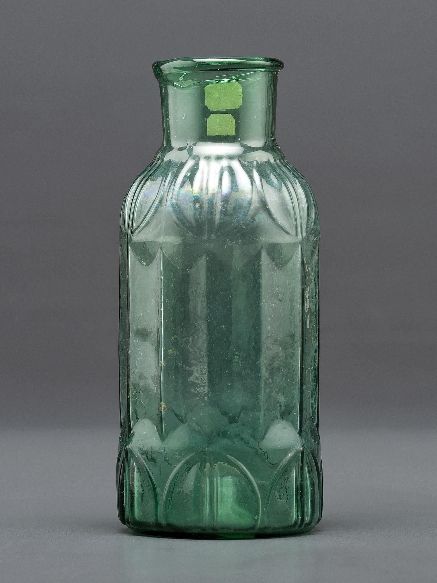 An Early Midwestern Glass Bottle in Green