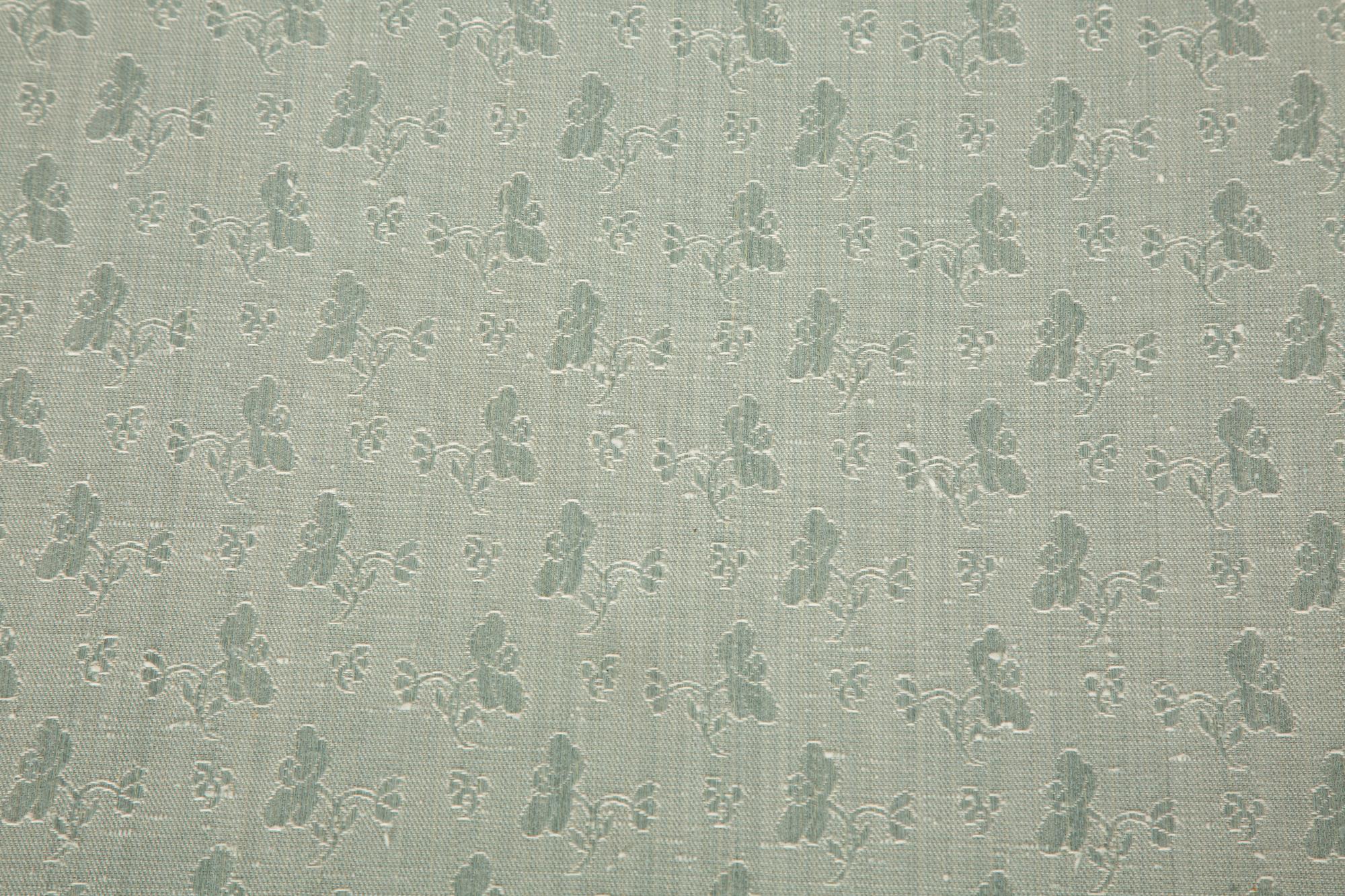 A Pale Blue Upholstered Club Chair with Matching Ottoman