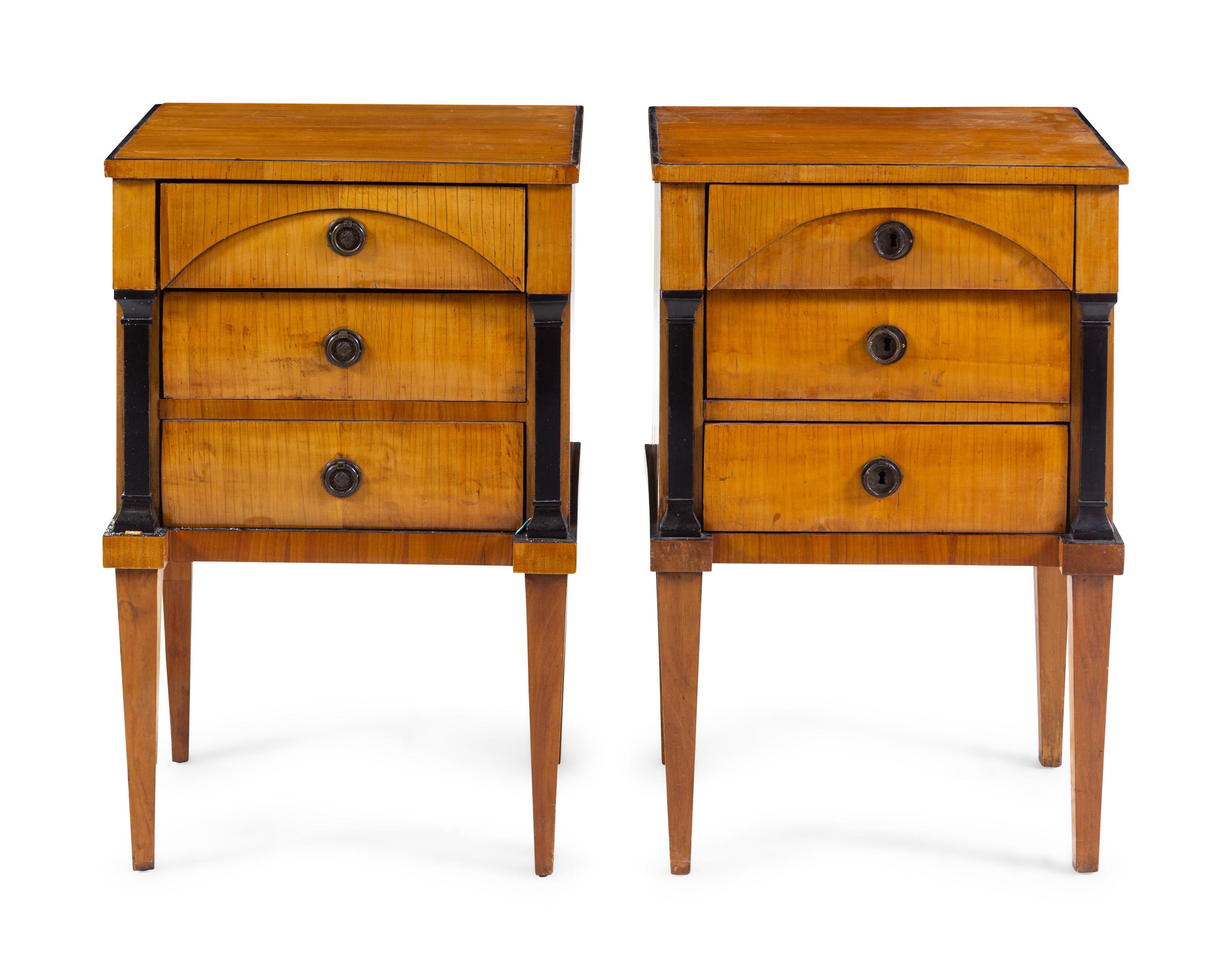 A Pair of Biedermeier Parcel Ebonized Birch Nightstands