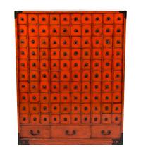 A Chinese Export Red Painted Apothecary Chest Height 37 1/2 x width 29 1/2 x depth 7 1/2 inches.