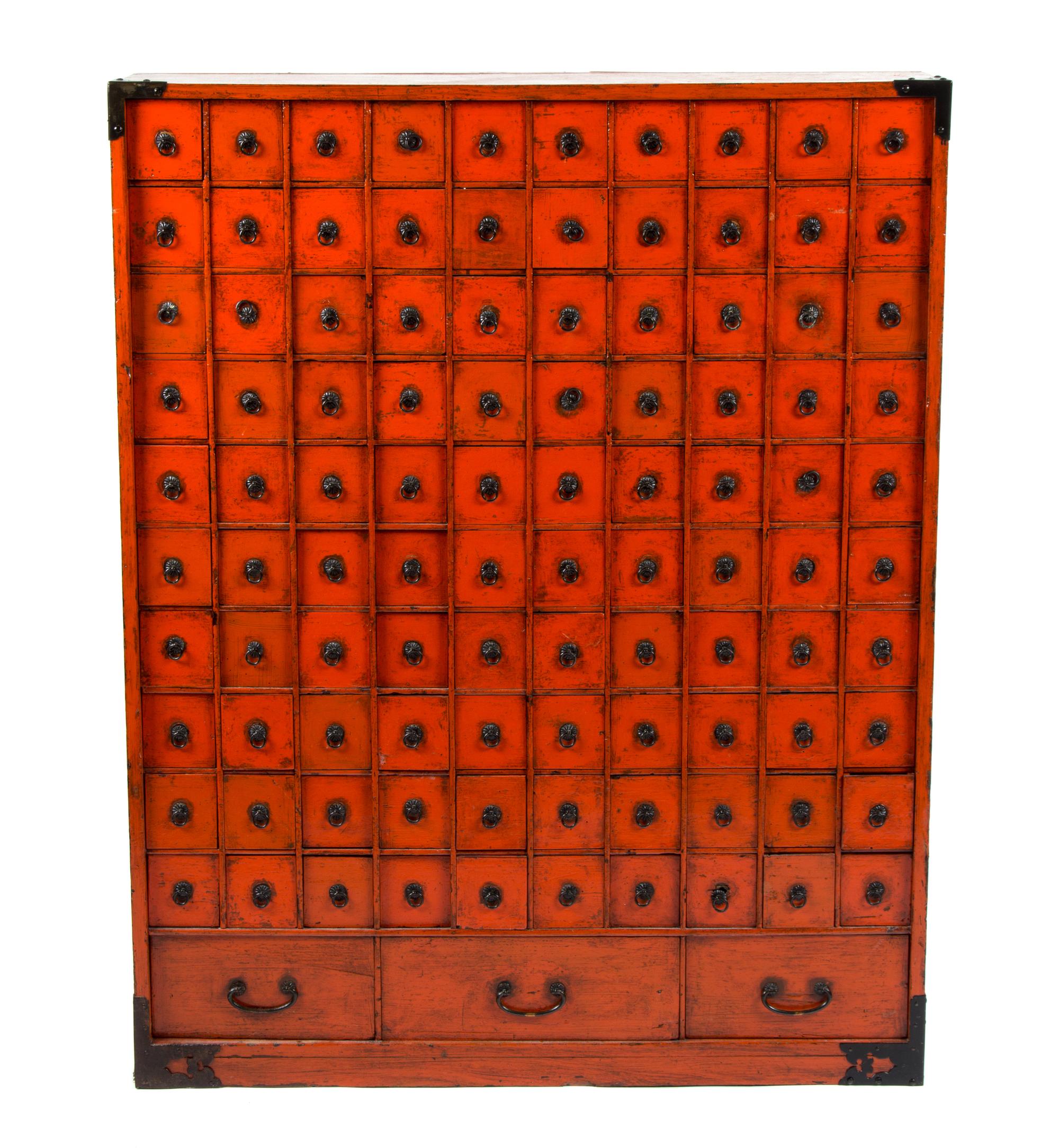 A Chinese Export Red Painted Apothecary Chest Height 37 1/2 x width 29 1/2 x depth 7 1/2 inches.
