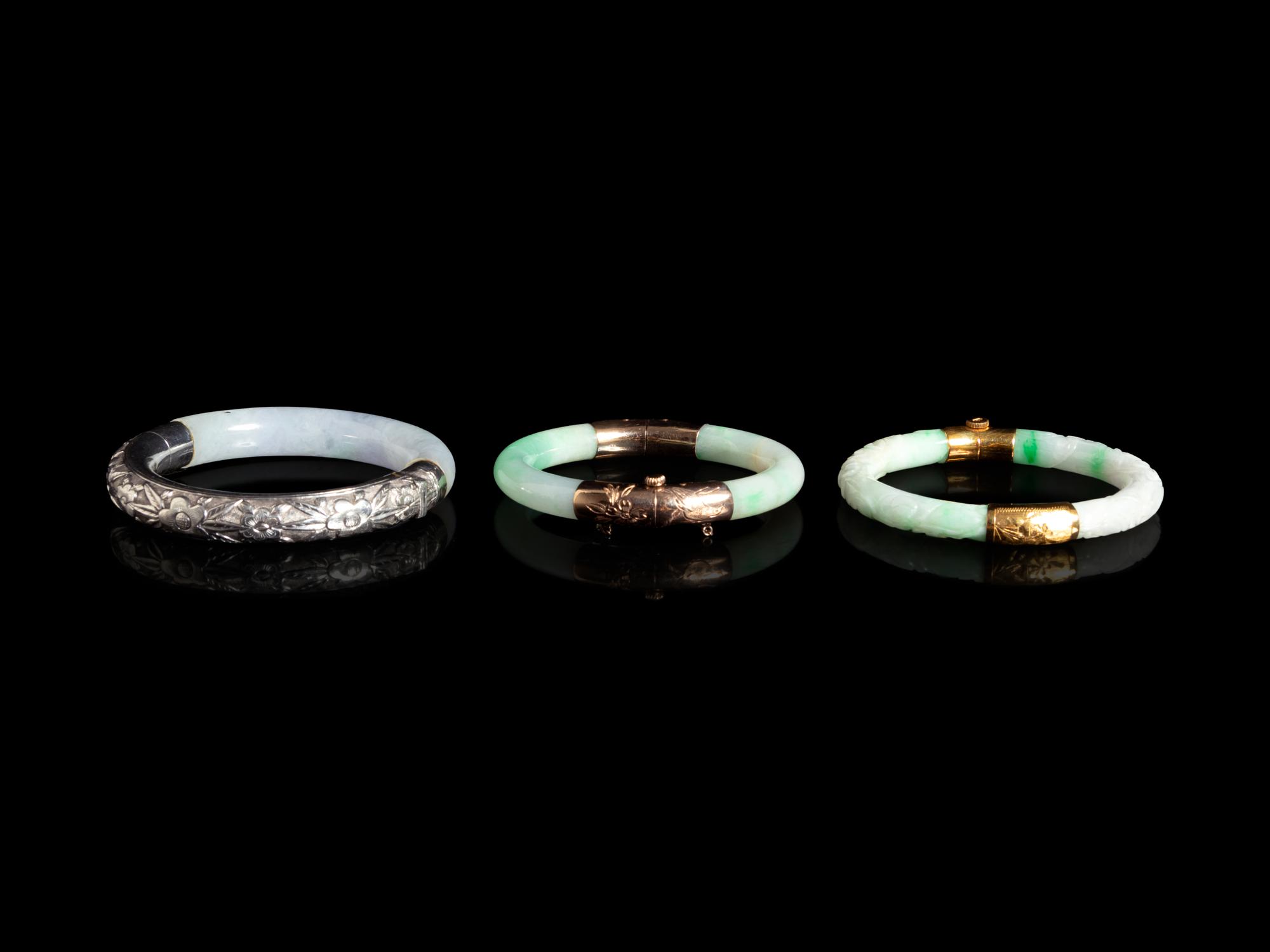 Three Chinese Silver and 14K Yellow Gold Jadeite Bangles