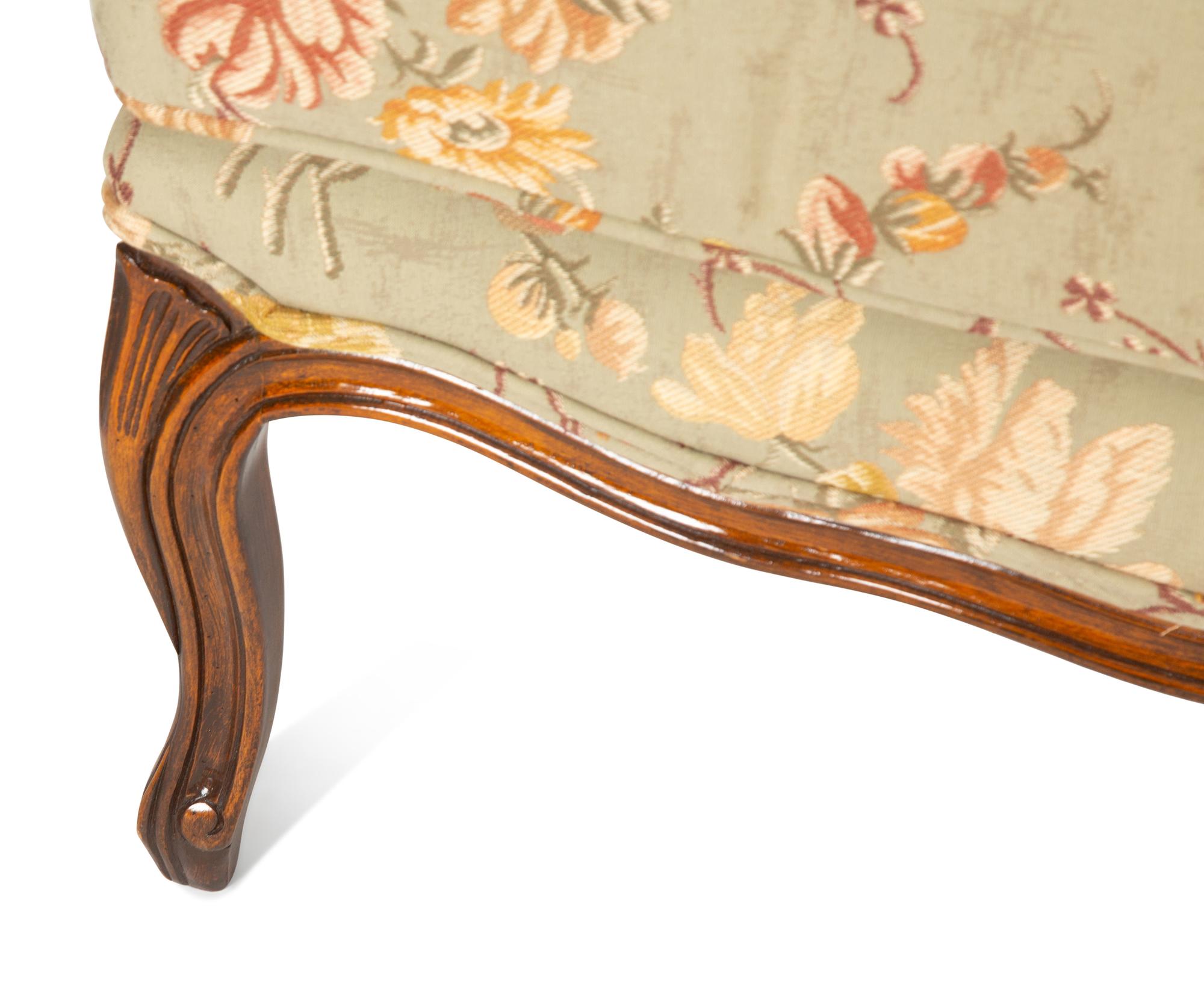 A Pair of Louis XV Style Fruitwood Bergères à Oreilles