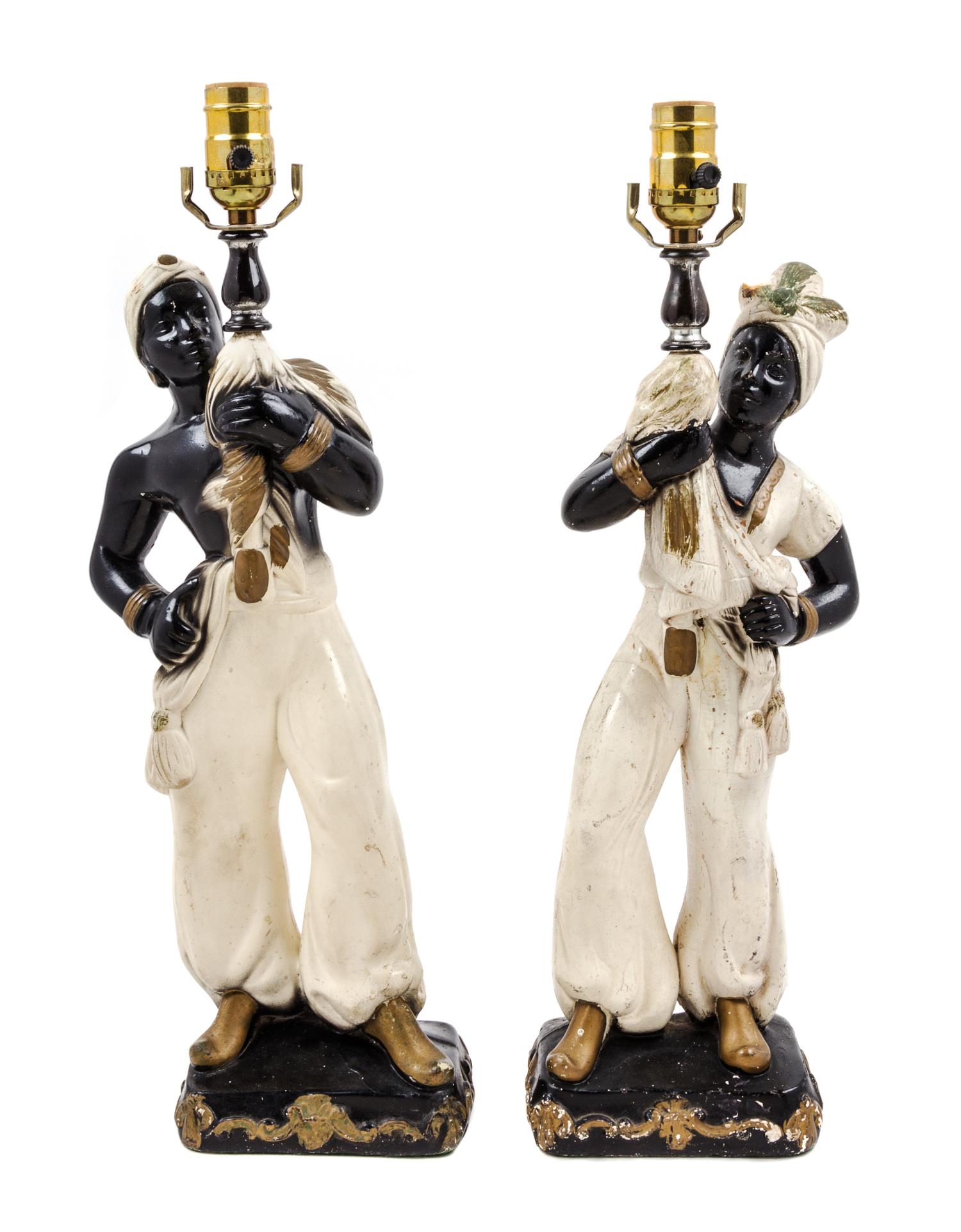 A Pair of Continental Parcel Gilt Porcelain Figural Lamps Height 18 inches.