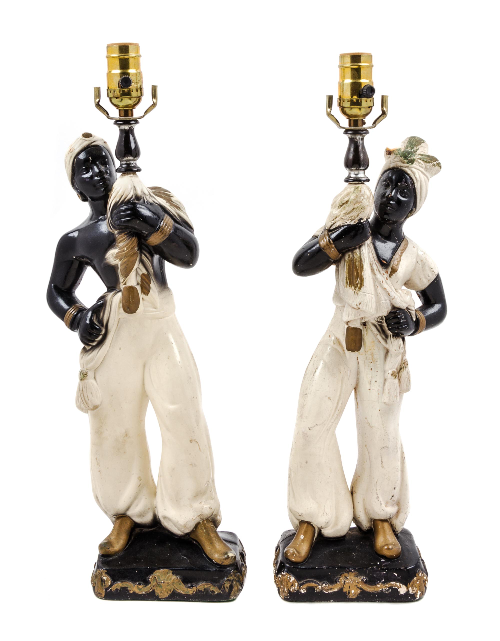 A Pair of Continental Parcel Gilt Porcelain Figural Lamps Height 18 inches.