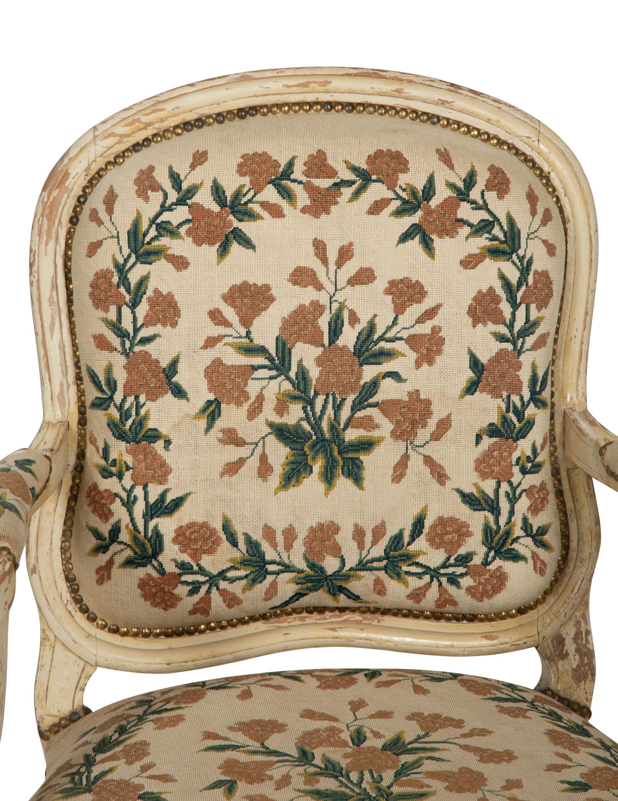 A Pair of Louis XVI Cream Painted Fauteuils