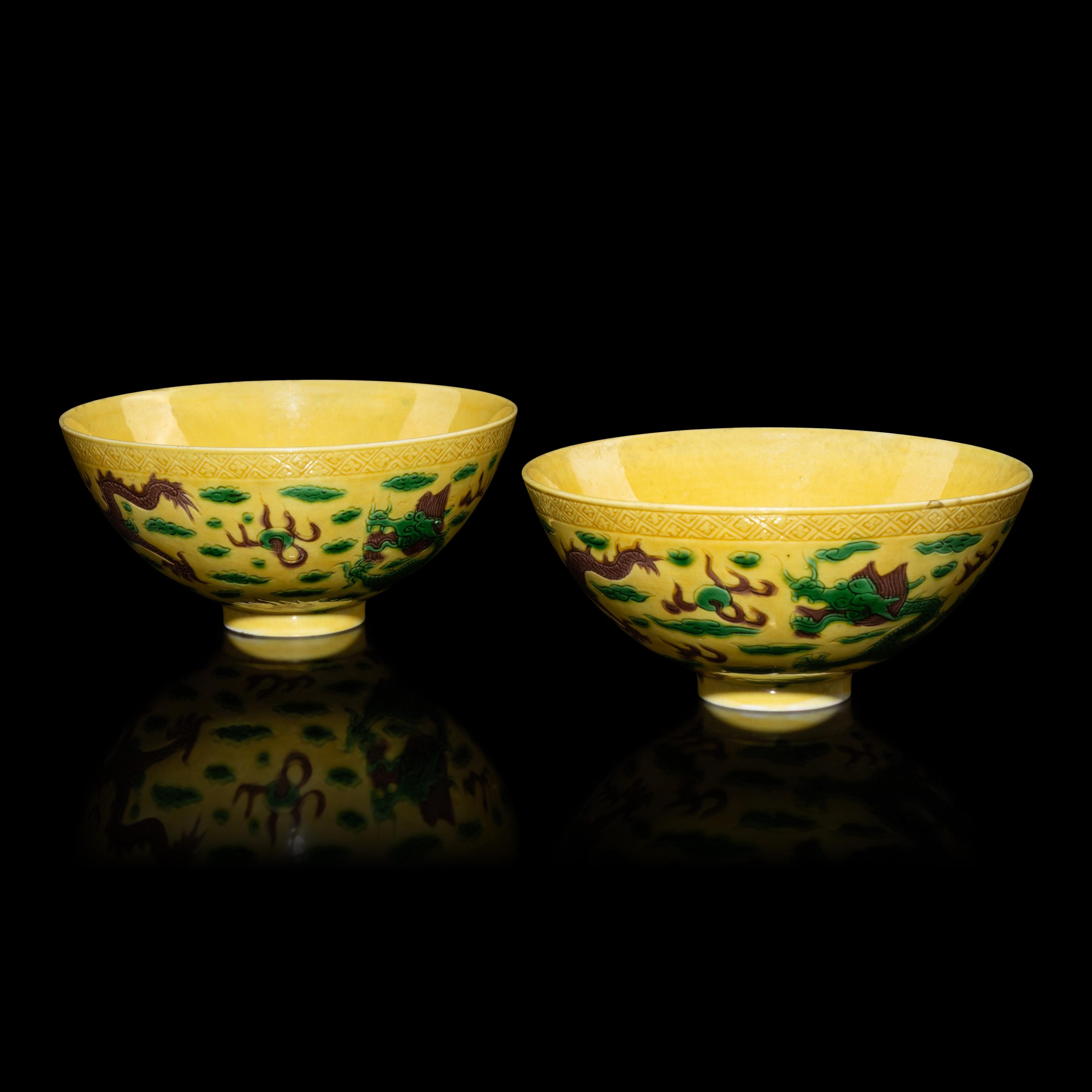 A Pair of Chinese Yellow-Ground Green and Aubergine-Enameled Porcelain 'Dragon' Bowls — 黃地素三彩龍紋碗一對