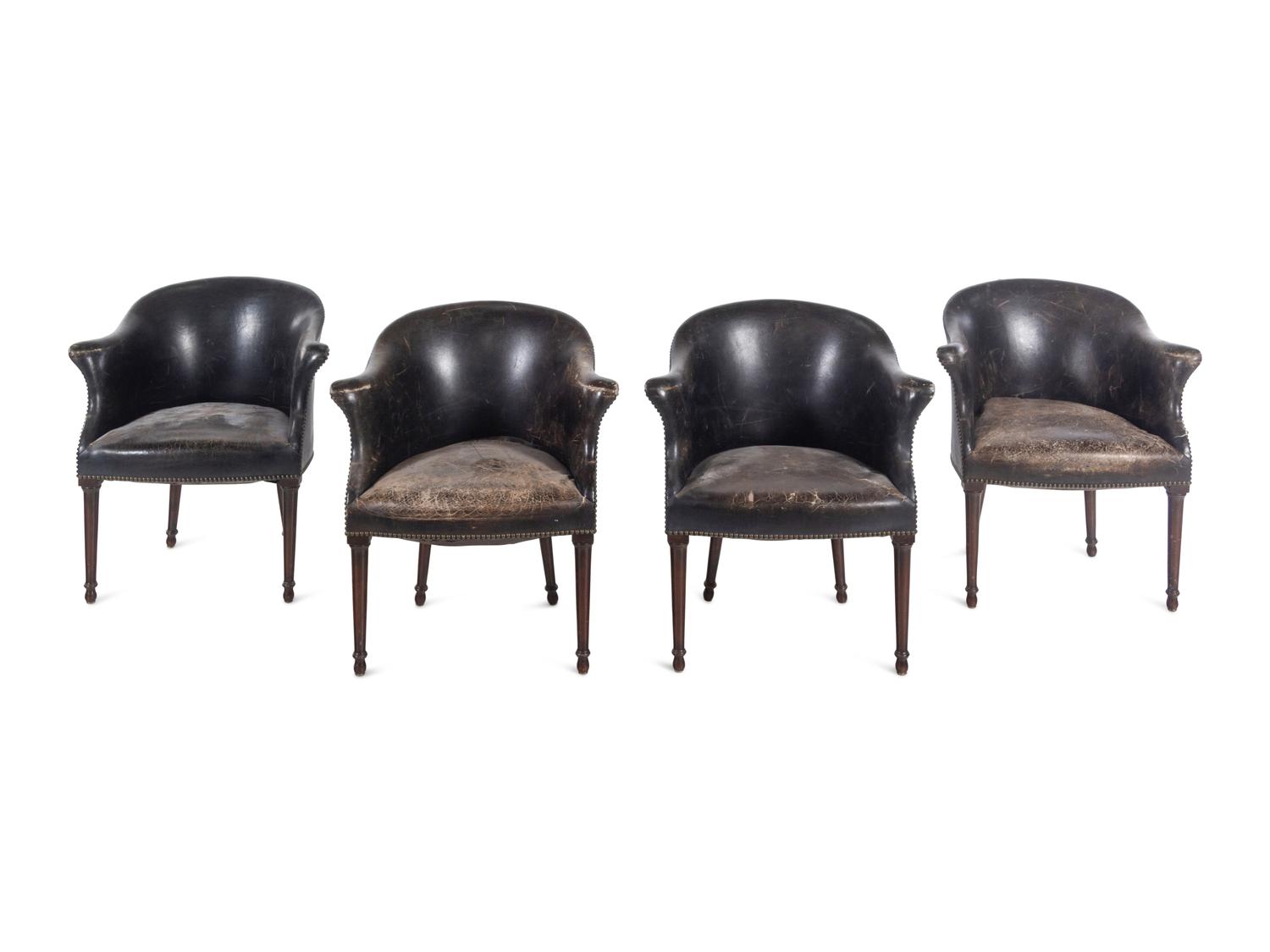 A Set of Four Leather Upholstered Armchairs