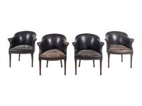 A Set of Four Leather Upholstered Armchairs