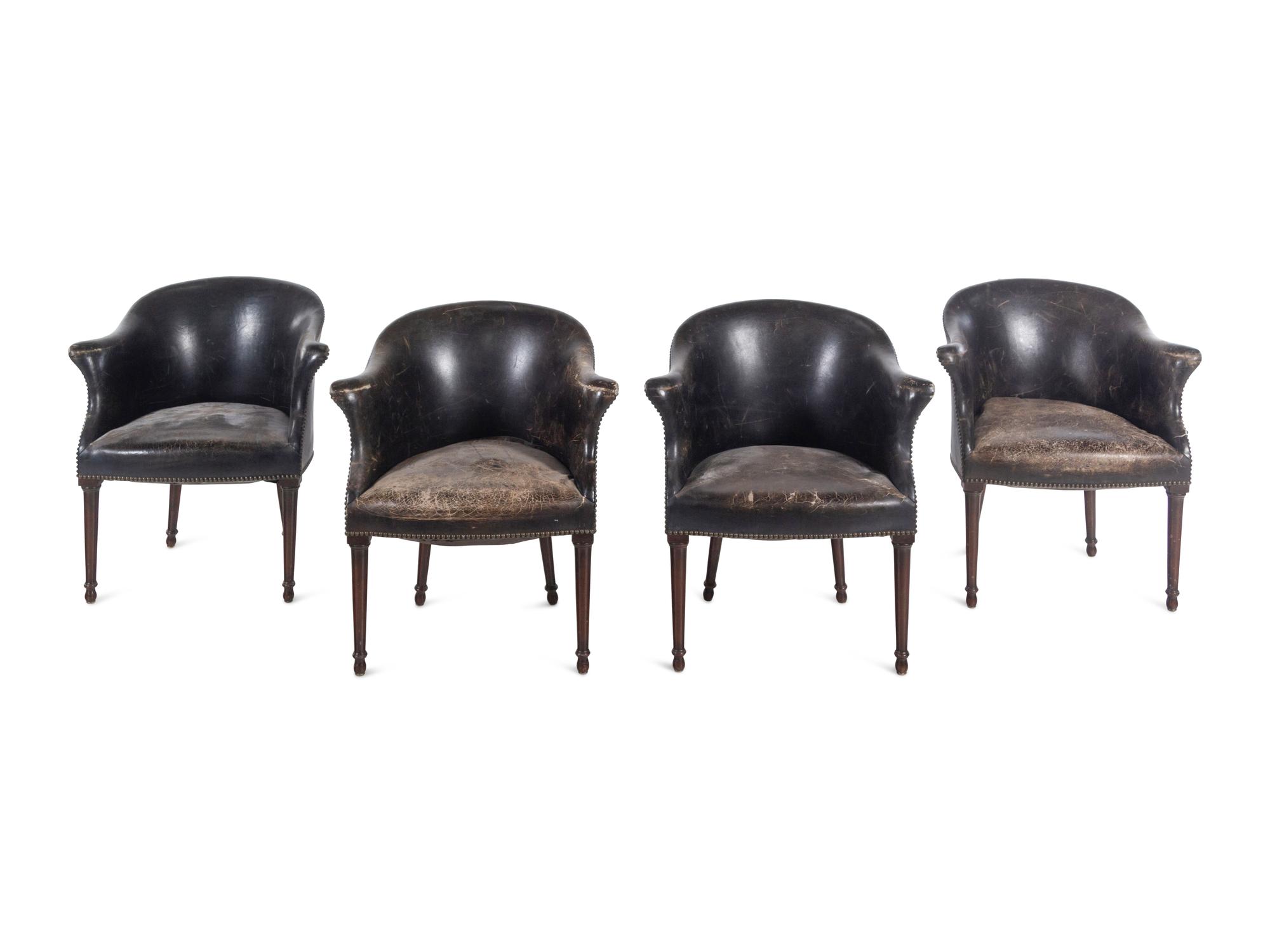 A Set of Four Leather Upholstered Armchairs