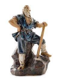 A Chinese Ceramic Figure of a Man