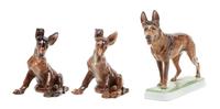 A Group of Three Rosenthal Porcelain German Shepherds Width of widest 8 1/2 inches.