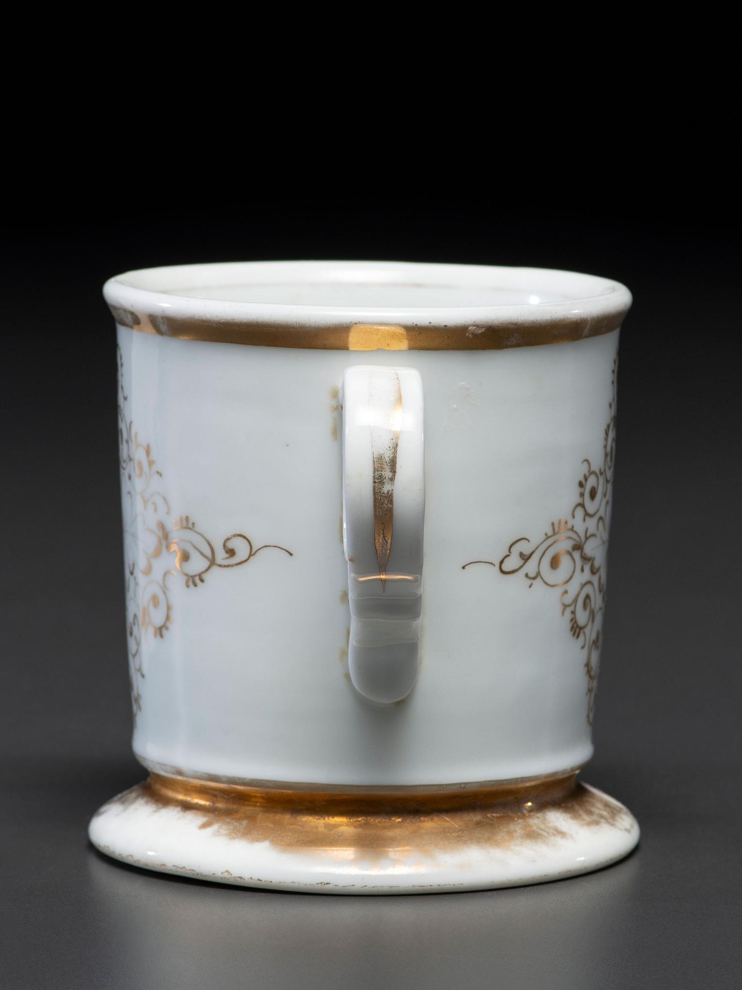A Dry Goods Store Proprietor's Porcelain Occupational Shaving Mug Belonging to John E. Schuon