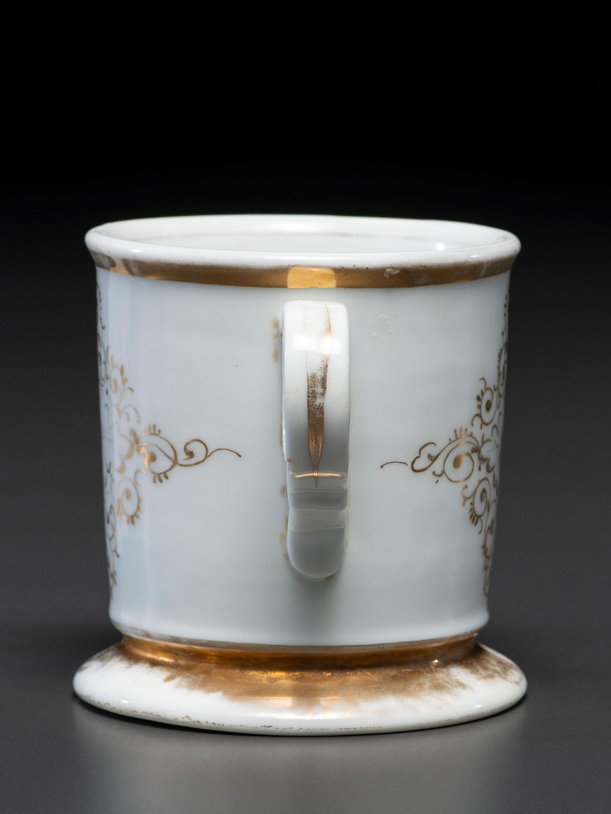 A Dry Goods Store Proprietor's Porcelain Occupational Shaving Mug Belonging to John E. Schuon