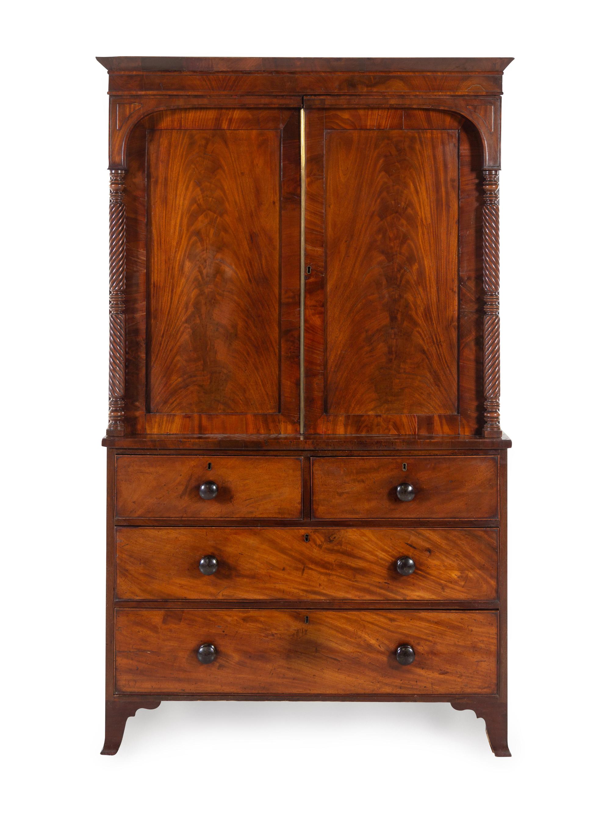 A George III Carved and Figured Mahogany Linen Press