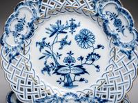 Fourteen Meissen ' Blue Onion' Reticulated Porcelain Plates