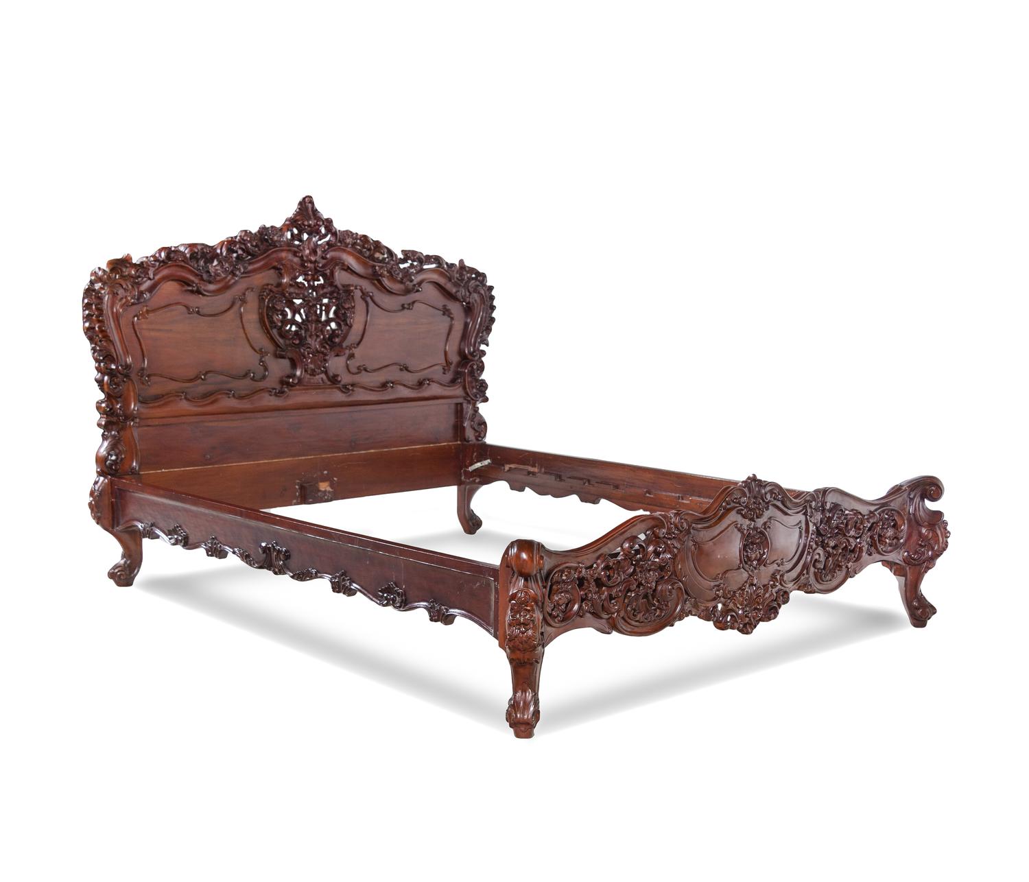 A Rococo Revival Carved Walnut Bed