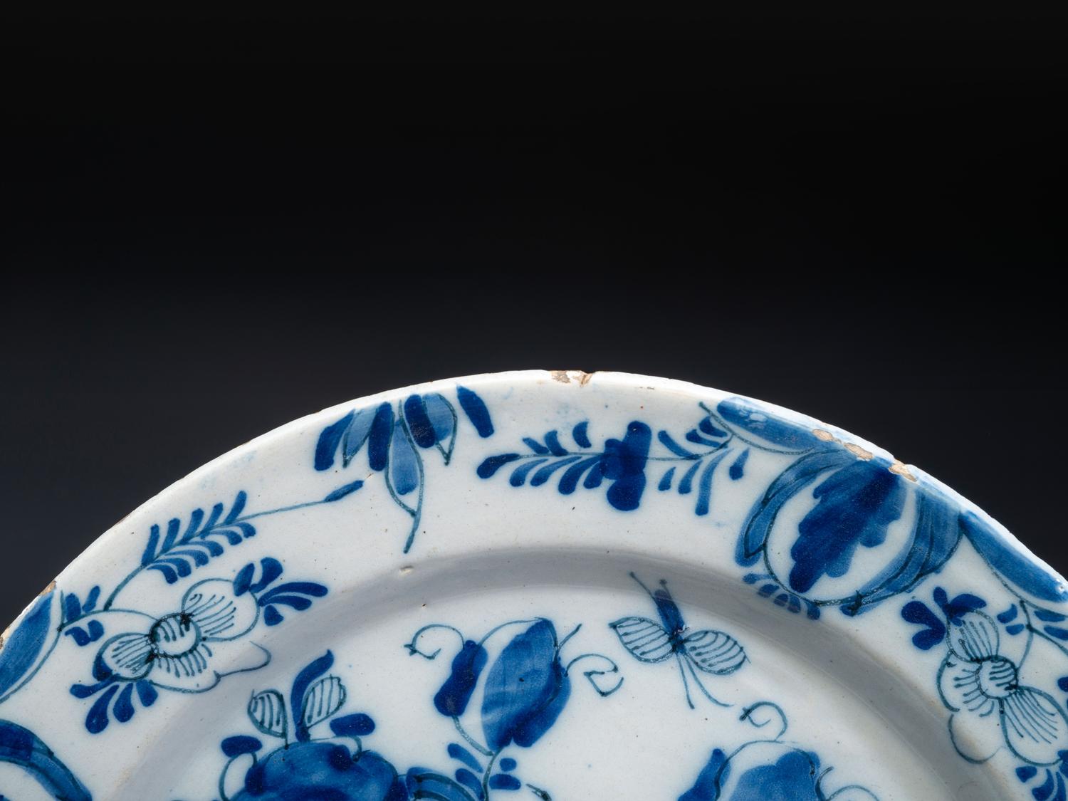 A Floral Decorated Delftware Charger