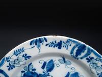 A Floral Decorated Delftware Charger