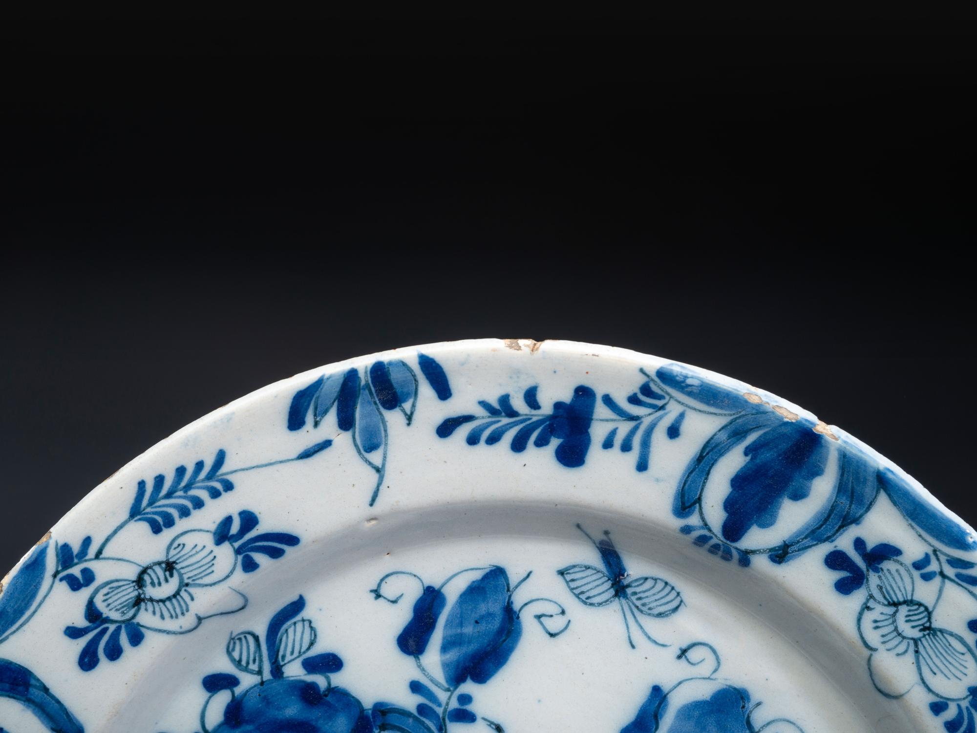 A Floral Decorated Delftware Charger