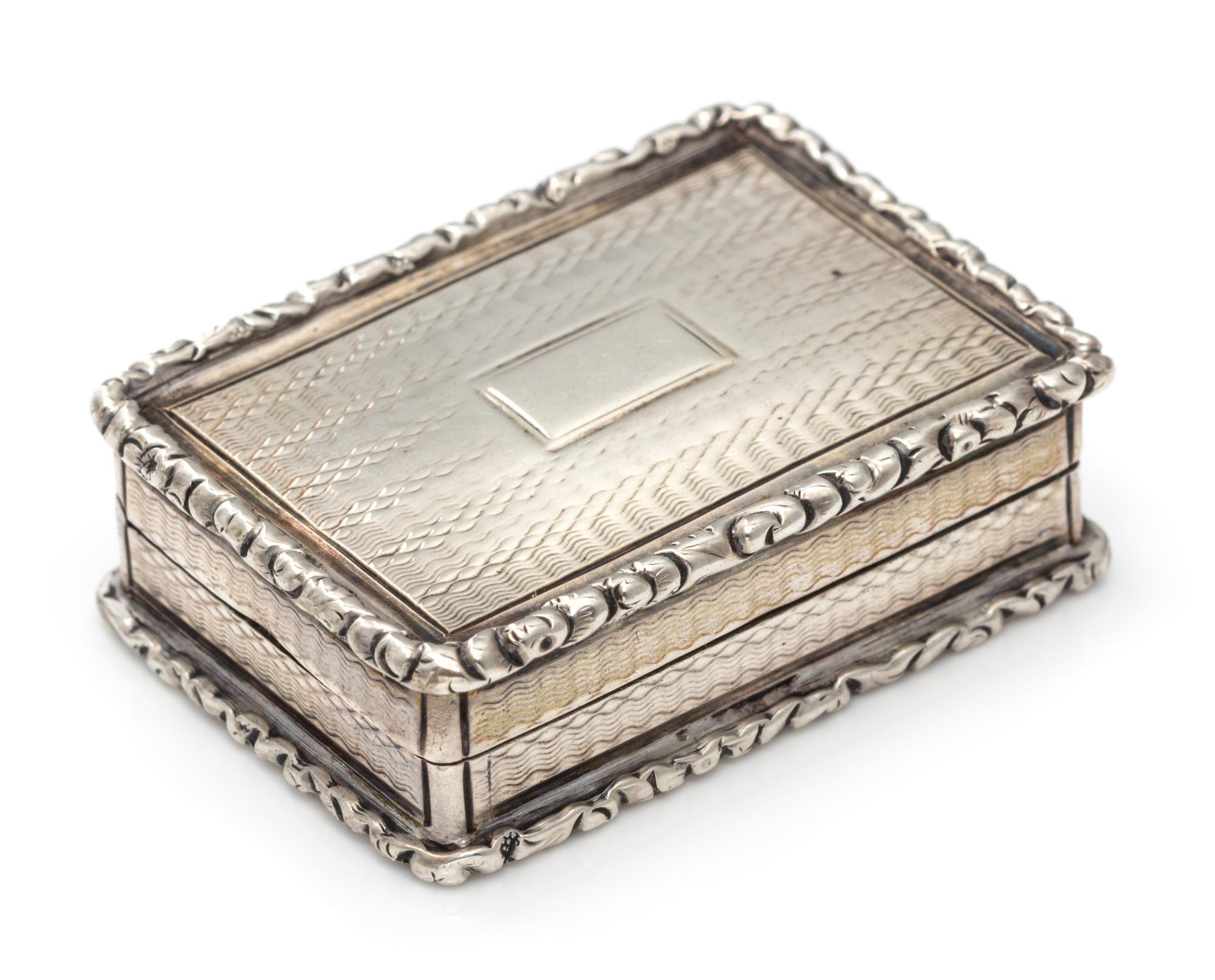 A William IV Silver Vinaigrette, John Bettridge, Birmingham, 1832, the case with an engine turned and volute decorated border.