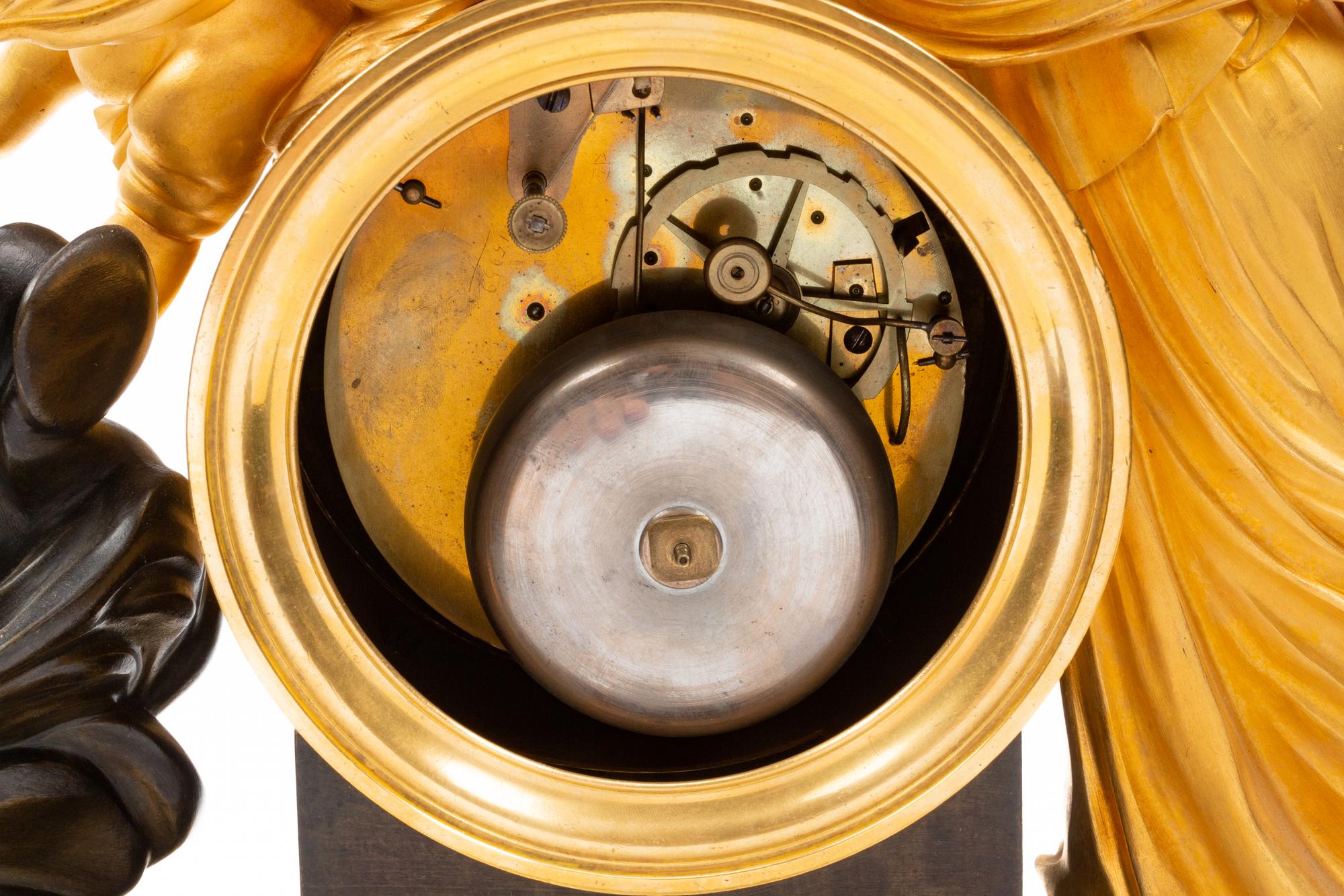 An Empire Gilt and Patinated Bronze Figural Mantel Clock