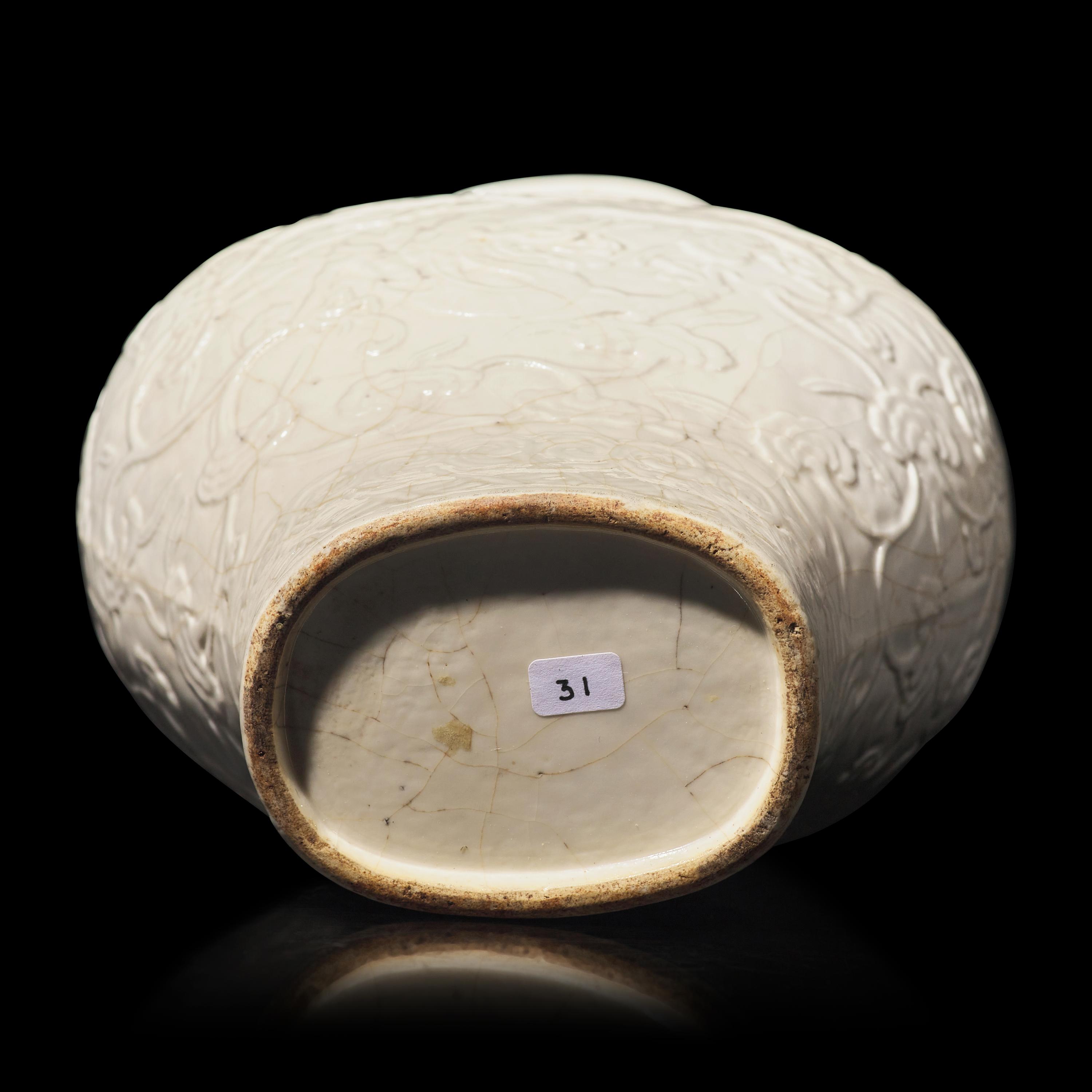 A Chinese White Glazed Soft Paste Molded 'Dragons and Lingzhi' Vase, 18th Century 清中期 白釉模印漿胎靈芝螭龍紋瓶