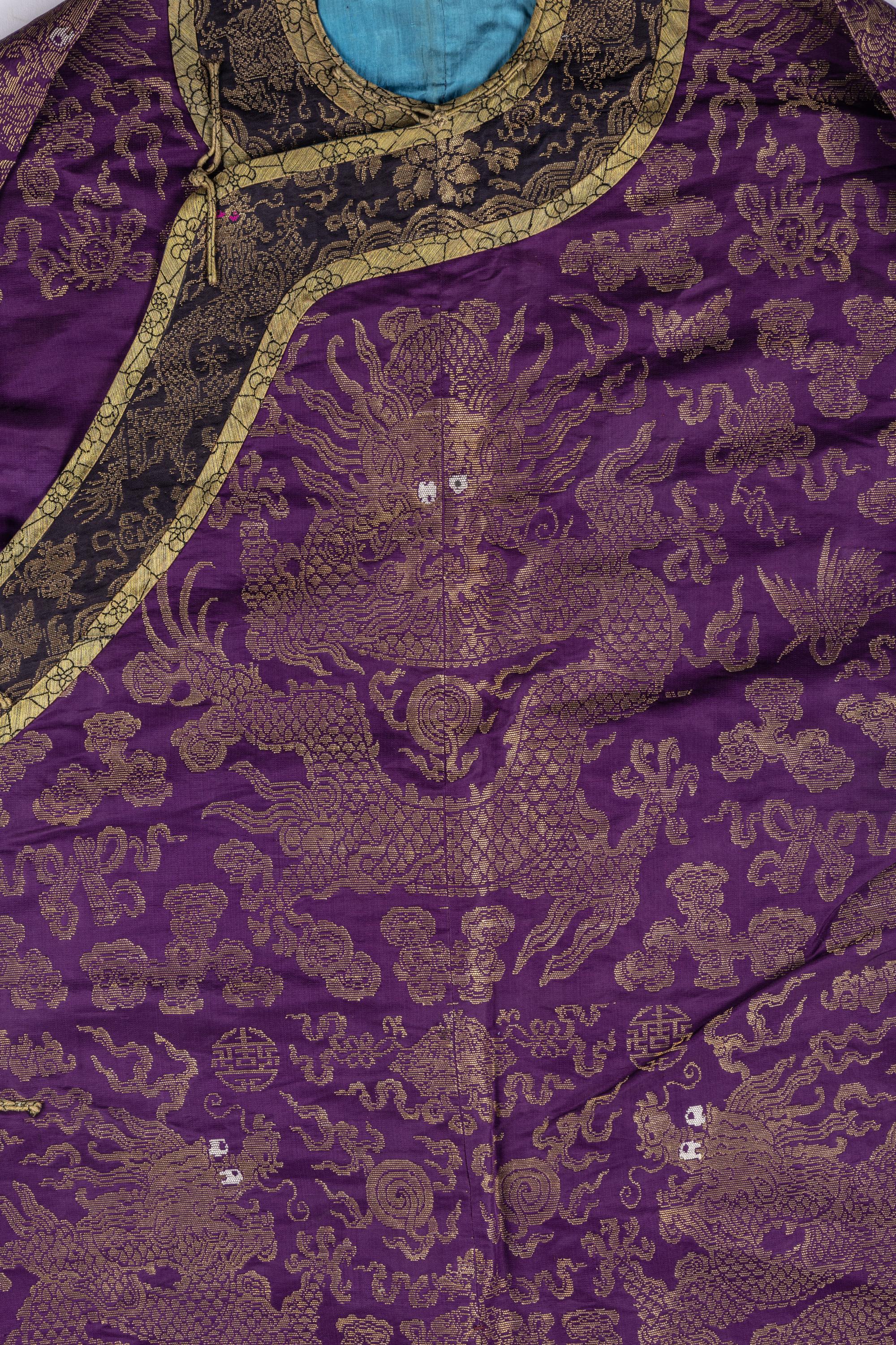 A Chinese Magenta Gold Brocade Dragon Robe