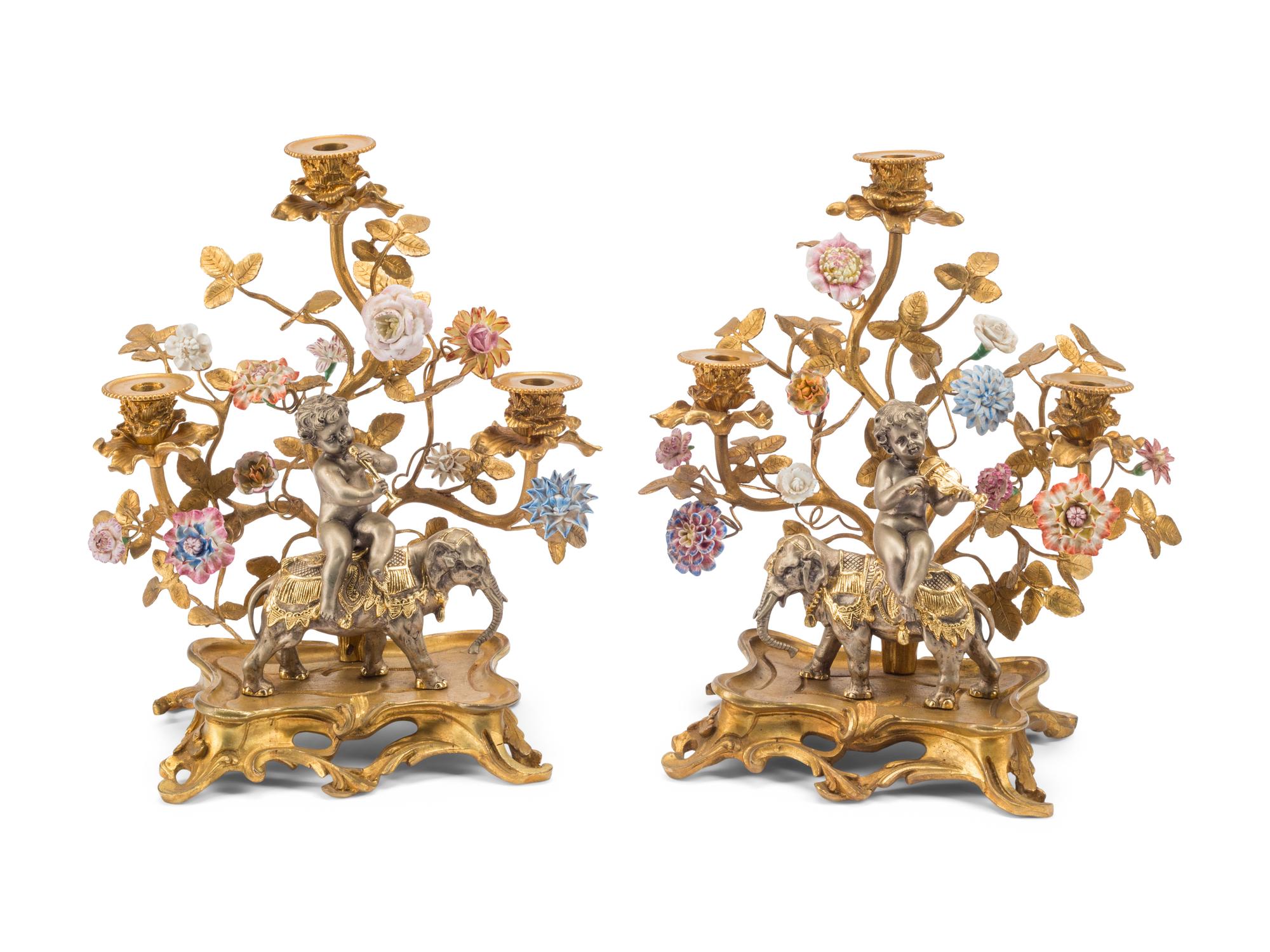 A Pair of Louis XV Style Gilt Bronze, Silvered Bronze and Porcelain Candelabra