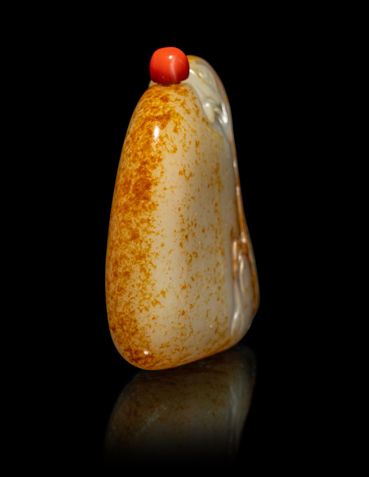 A Chinese Russet and White Jade 'Monkey and Peach' Snuff Bottle