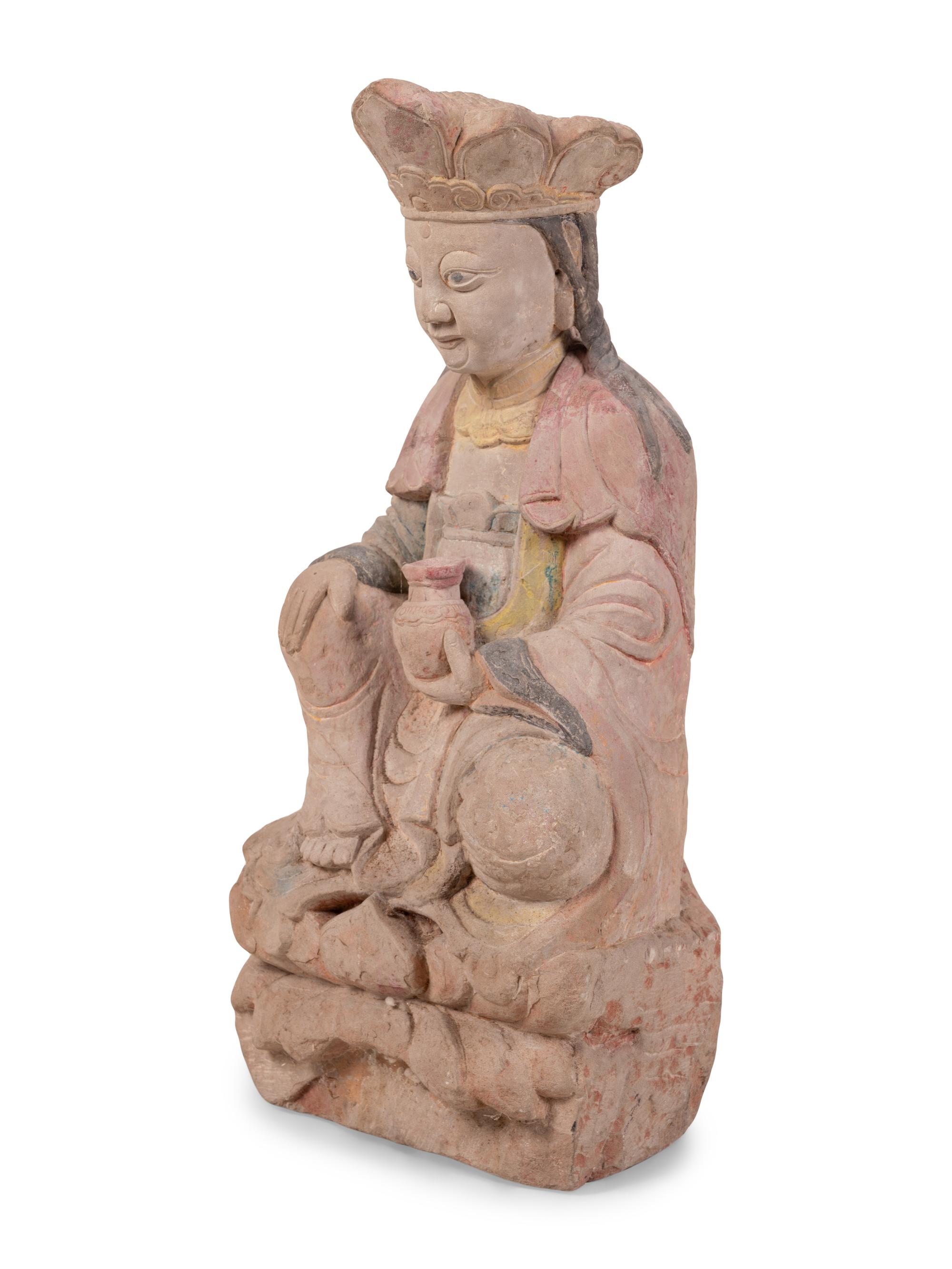 A Chinese Carved Stone Seated Figure with Polychrome Decoration