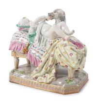 A Meissen Porcelain Figural Group of a Child in Bed with Dog