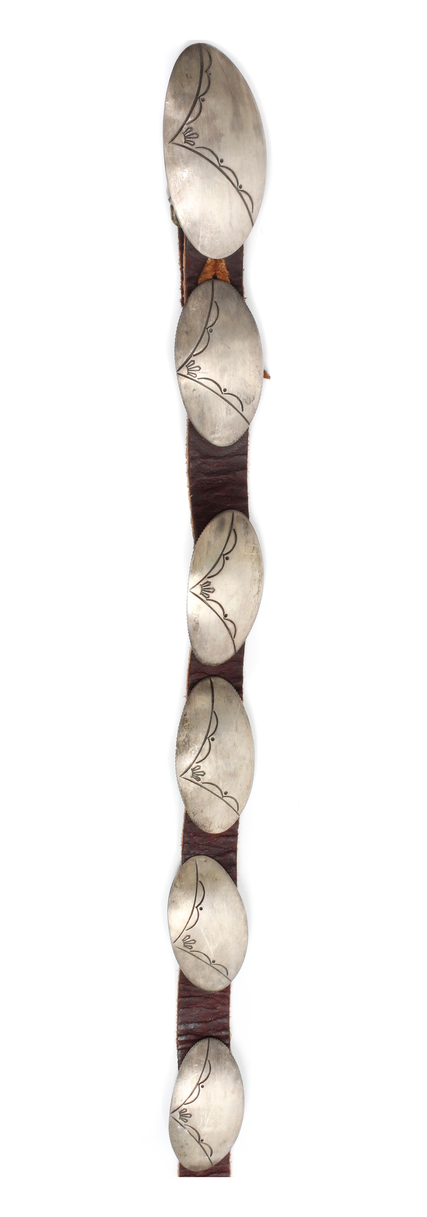 A Hopi Silver Concha Belt Buckle height 1 1/4 x width 2 1/2 inches.