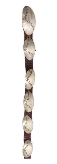A Hopi Silver Concha Belt Buckle height 1 1/4 x width 2 1/2 inches.