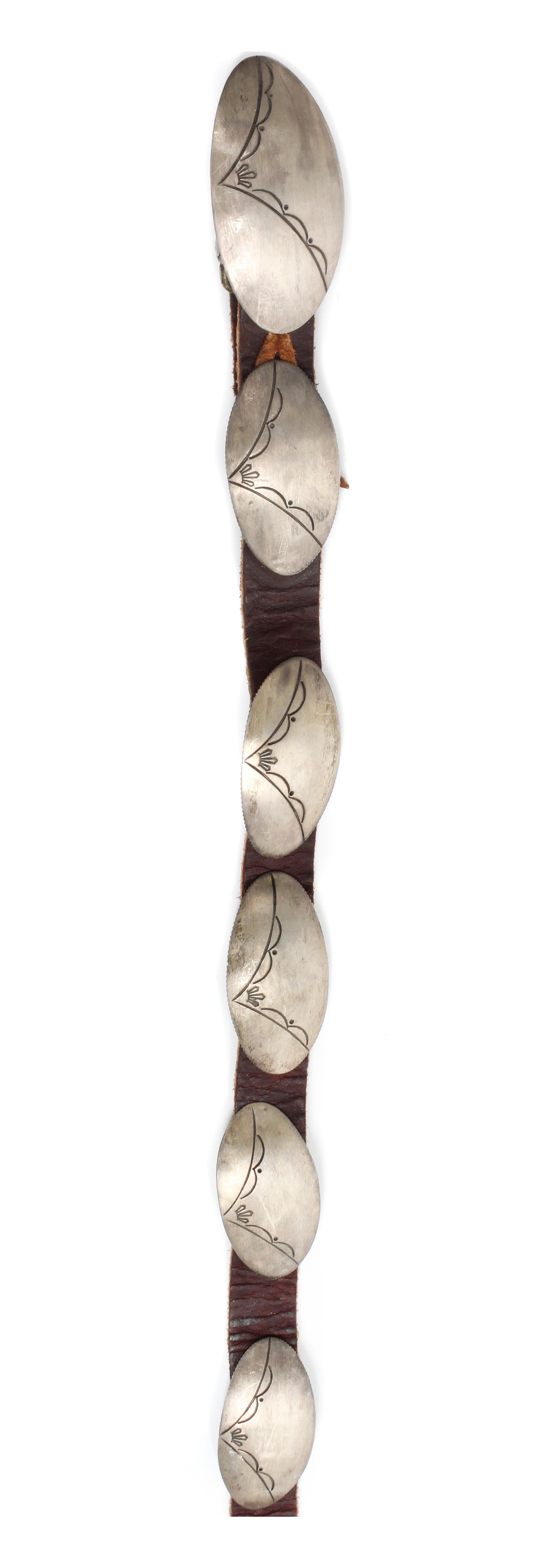 A Hopi Silver Concha Belt Buckle height 1 1/4 x width 2 1/2 inches.