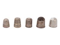 A Group of Five Silver Children's Thimbles