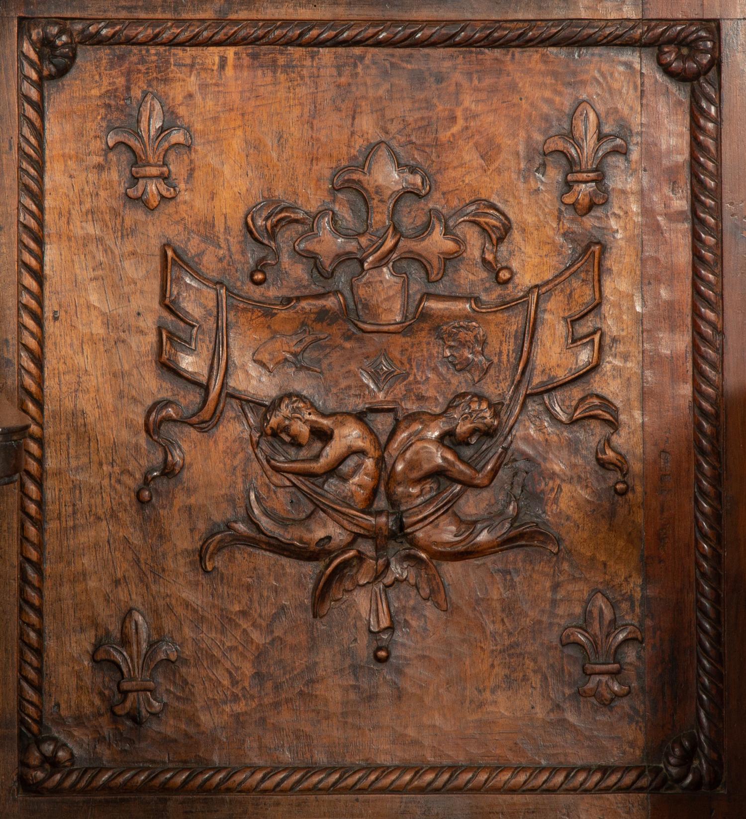 A Near Pair of Late Gothic Walnut and Oak Choir Stalls