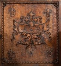 A Near Pair of Late Gothic Walnut and Oak Choir Stalls