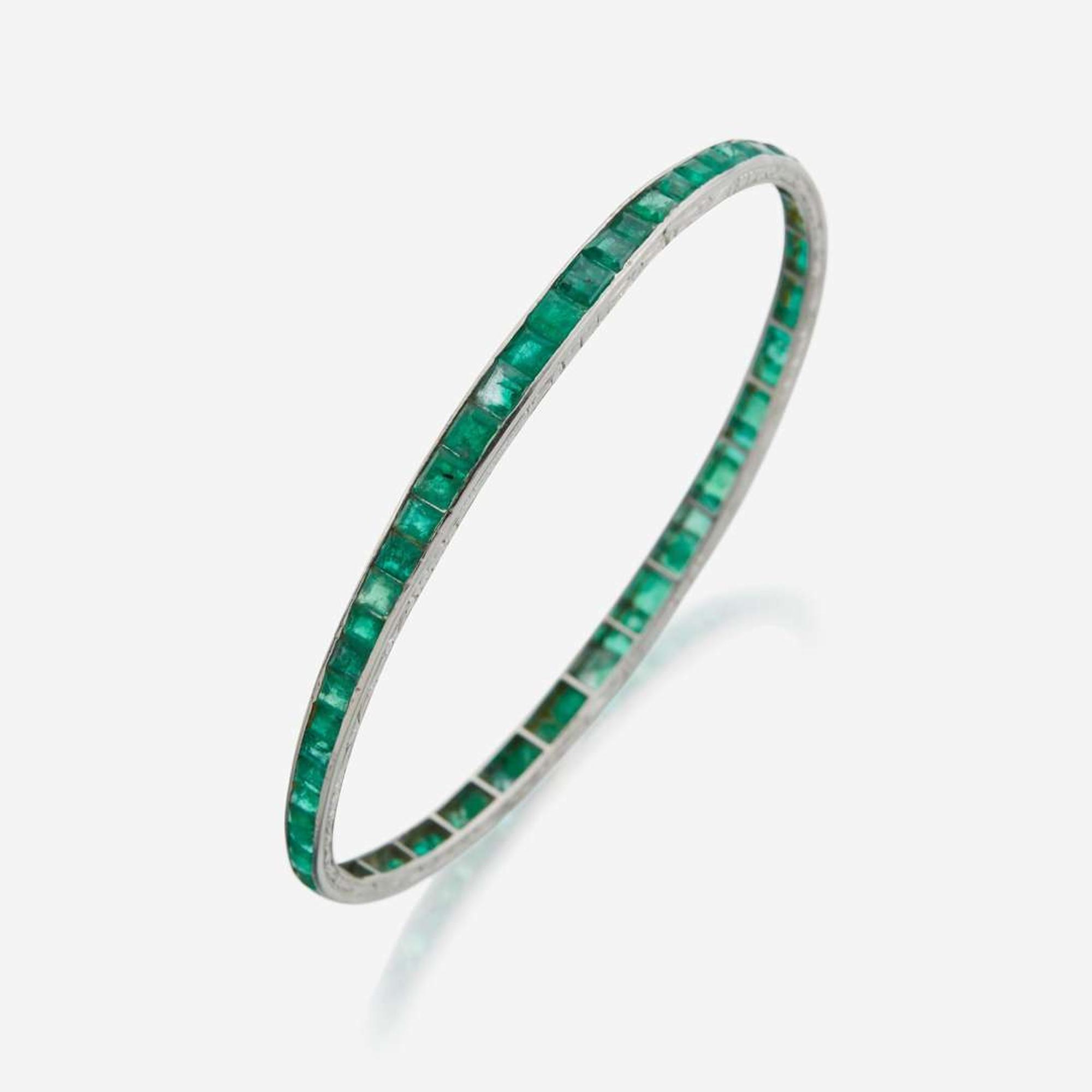 An emerald and platinum bangle