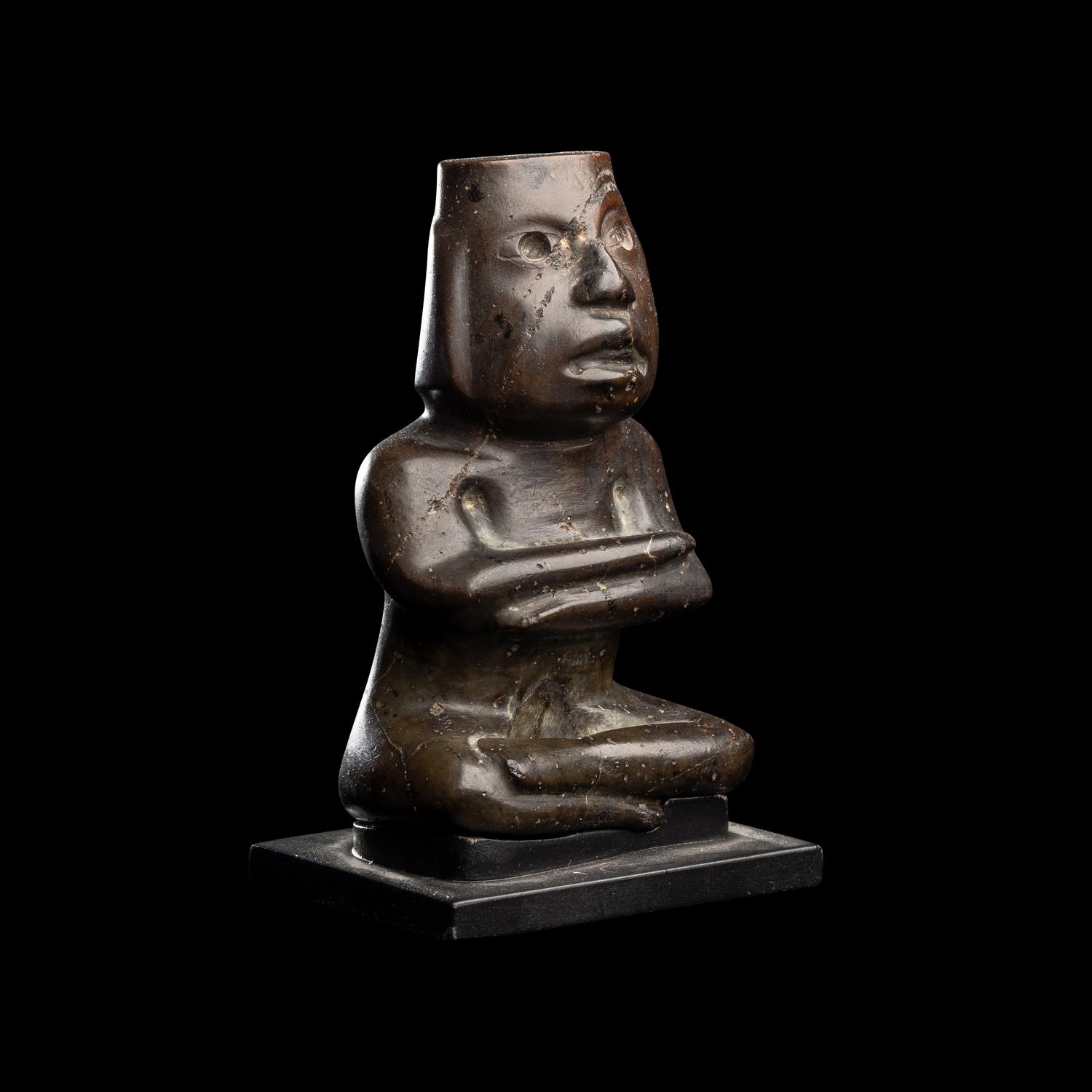 A Group of Twelve Pre-Colombian Style and Near Eastern Style Carved Stone Articles