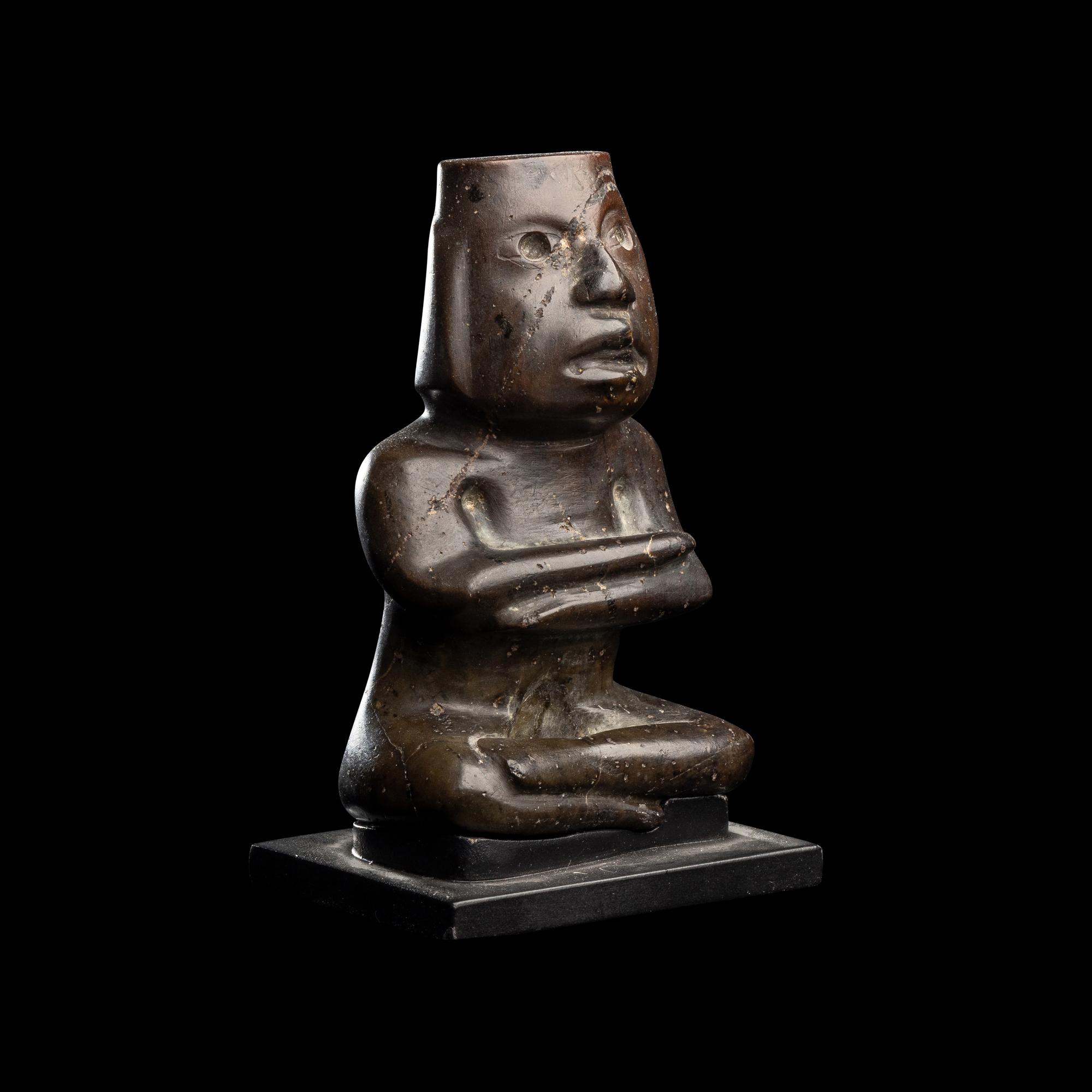 A Group of Twelve Pre-Colombian Style and Near Eastern Style Carved Stone Articles