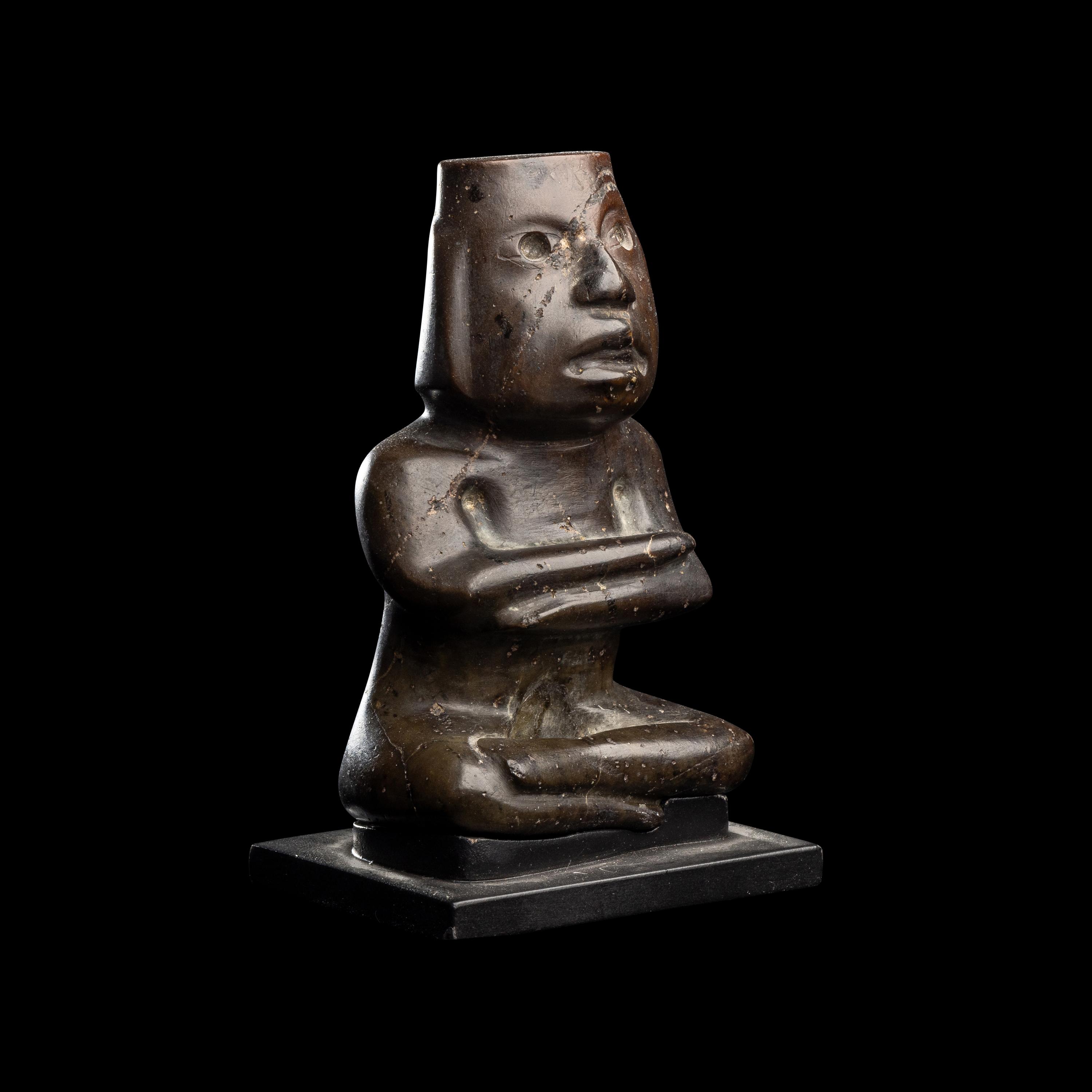 A Group of Twelve Pre-Colombian Style and Near Eastern Style Carved Stone Articles